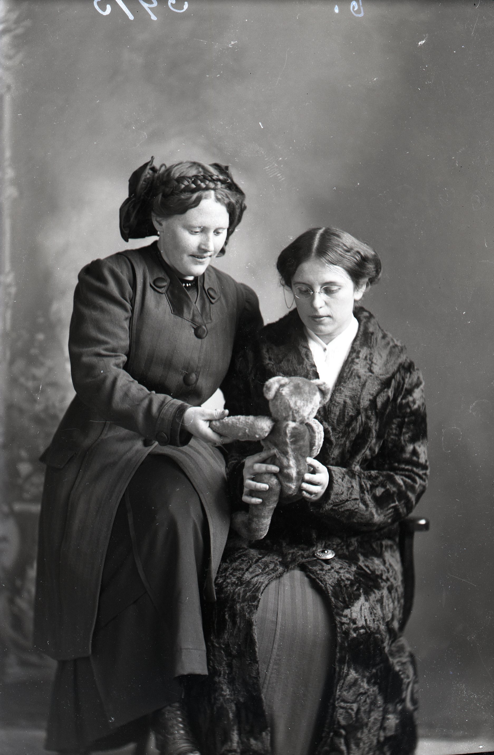 Two women with teddy bear