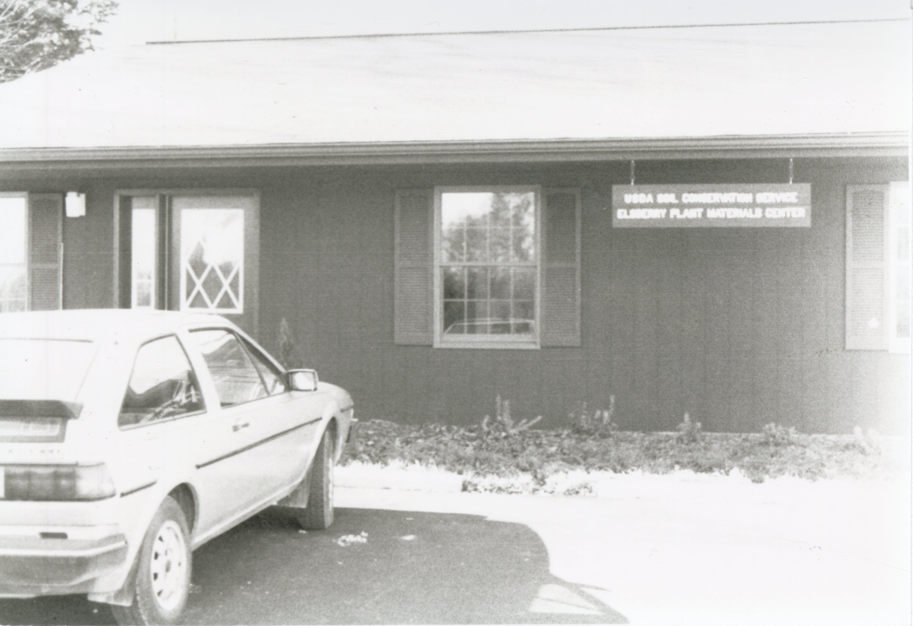 Unidentified car parked in front of Plant Materials Center