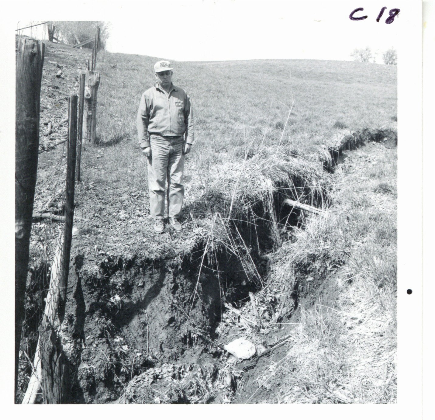 Eldon Wohlers inspecting gully on his farm