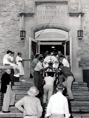 Carrying an Iron Lung into Luthern Hospital 