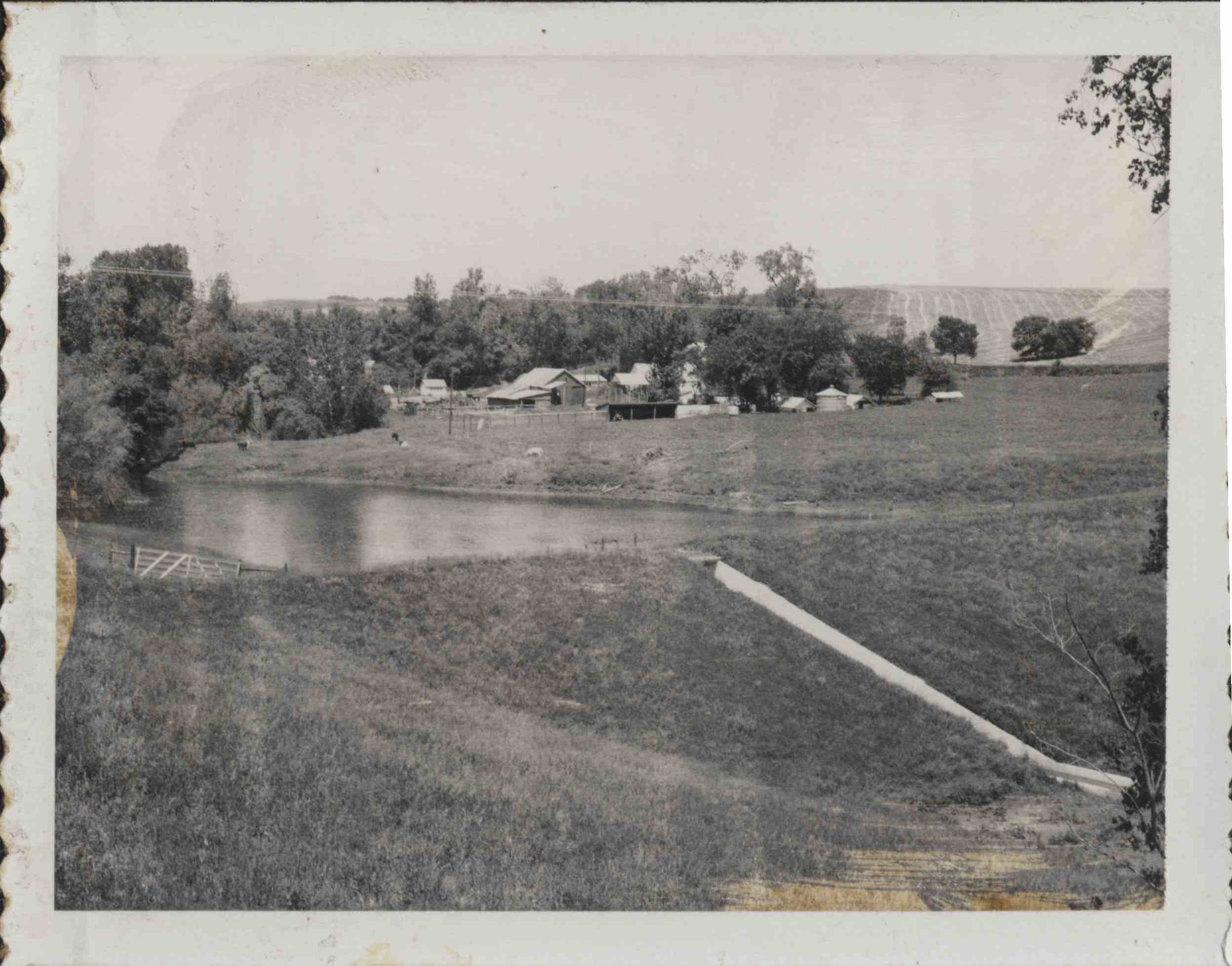 Watershed basin holding water with water chute for overflow