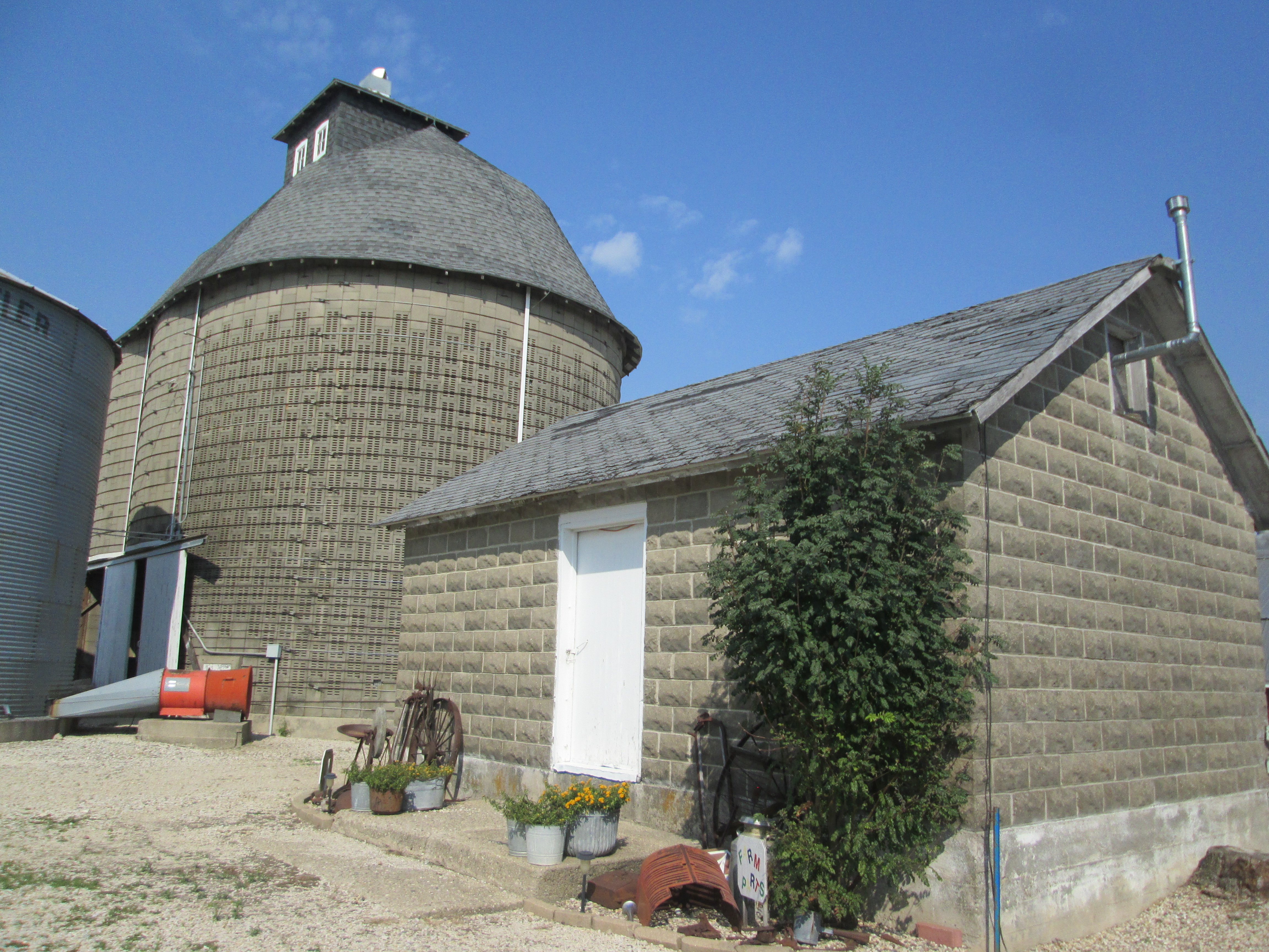 015.  Concrete corn crib and feed shed