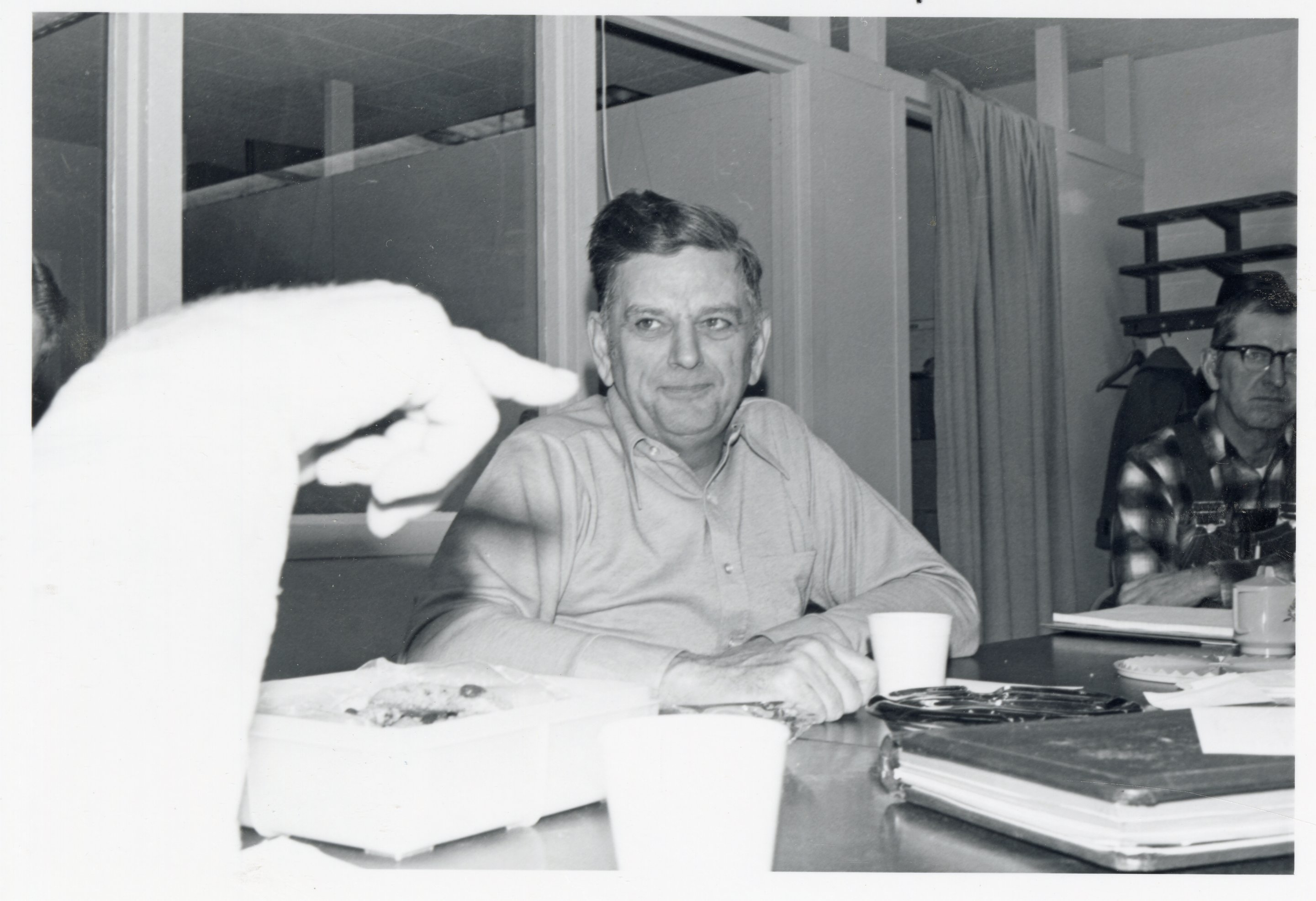 1970's Commissioners Dwight Stucker and Clyde Sherer sit at a meeting