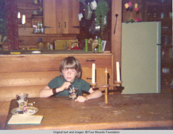 John, Jr. sitting at table