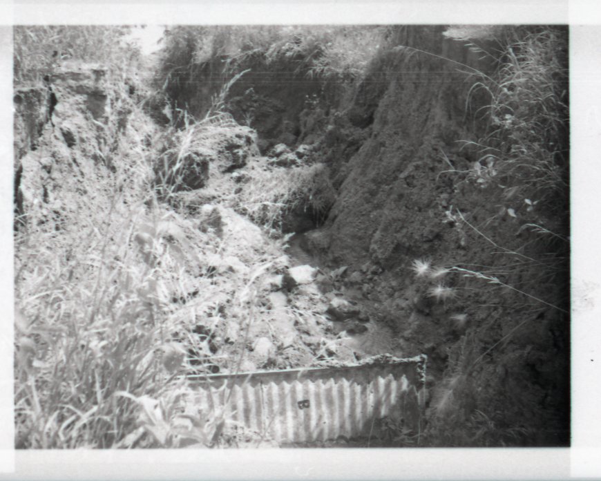 Rocky Ravine Dirt Stopped by Barrier