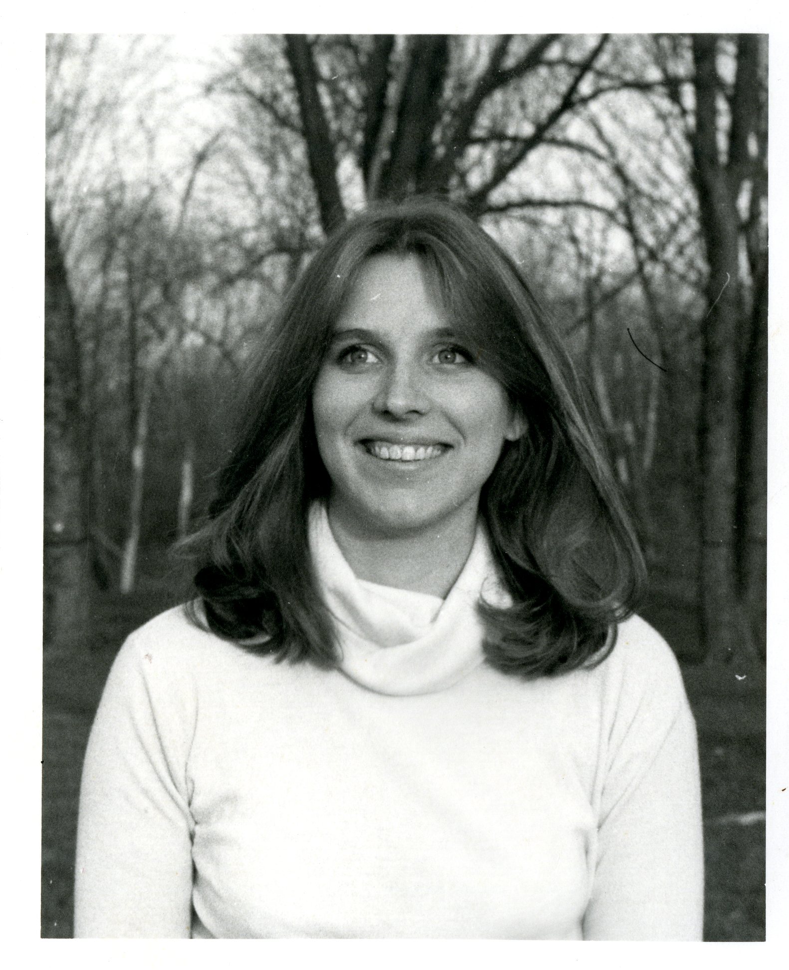 Woman Smiling Among Trees