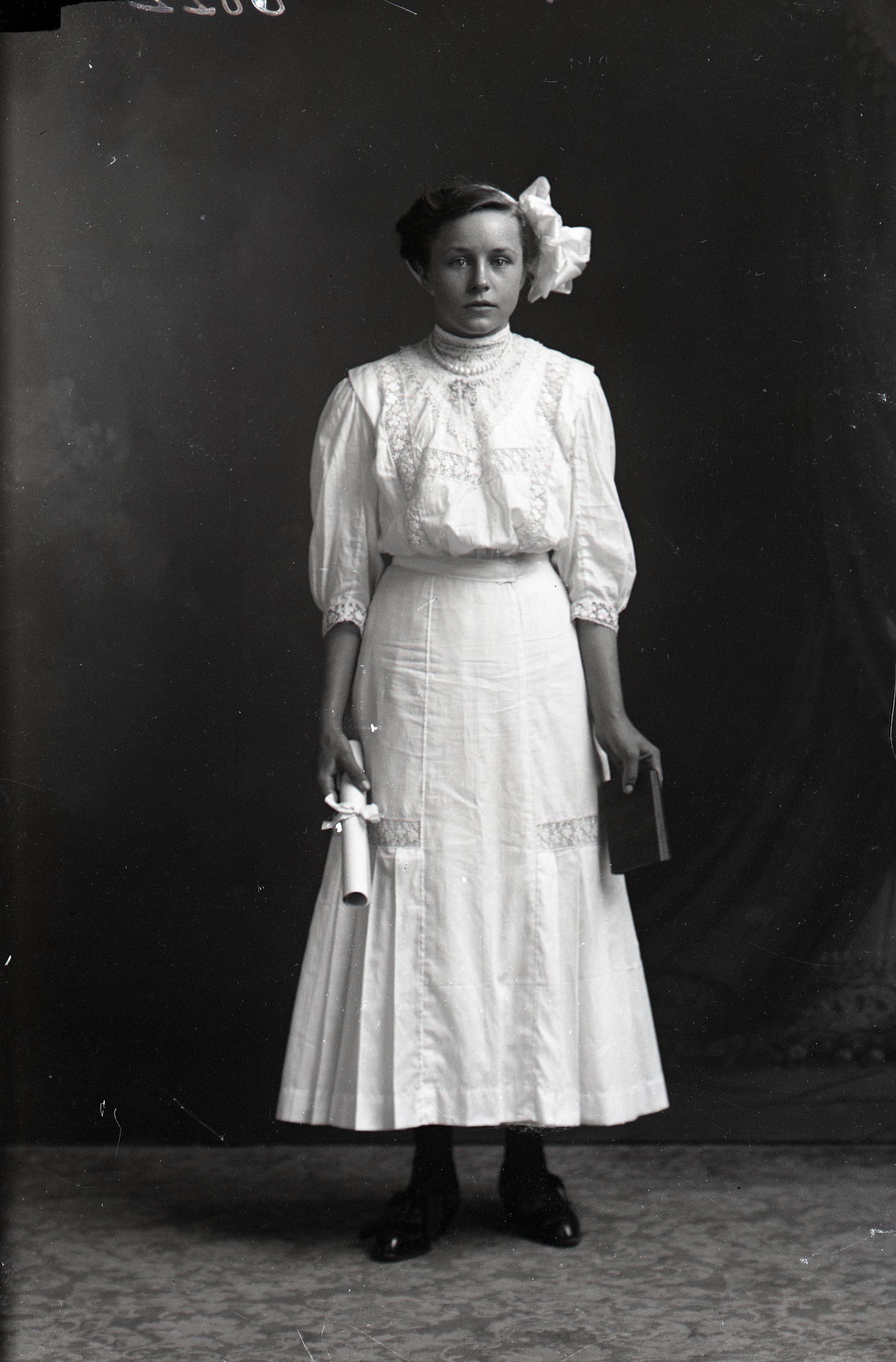 Woman with diploma and book