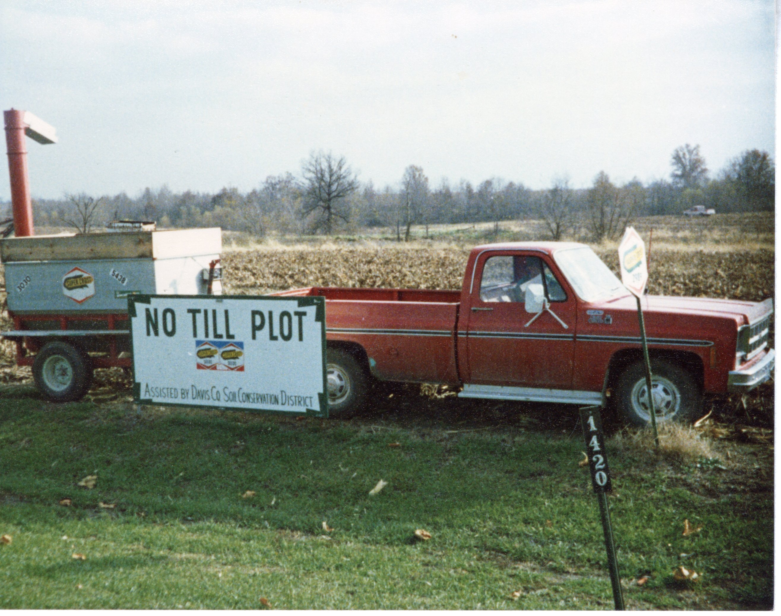 No-Till Plot Sign on Red Truck by corn field