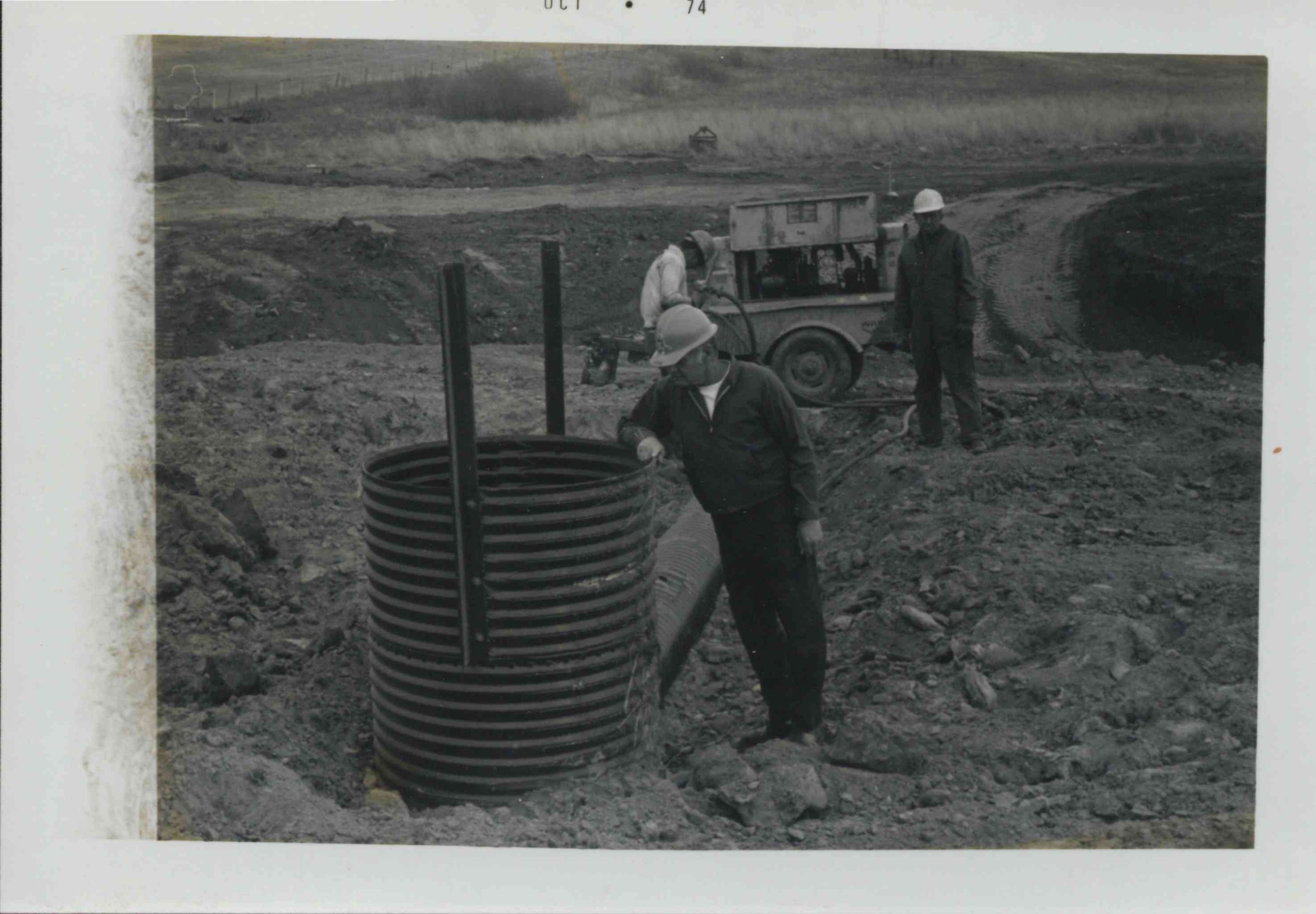 Three men in hard hats 