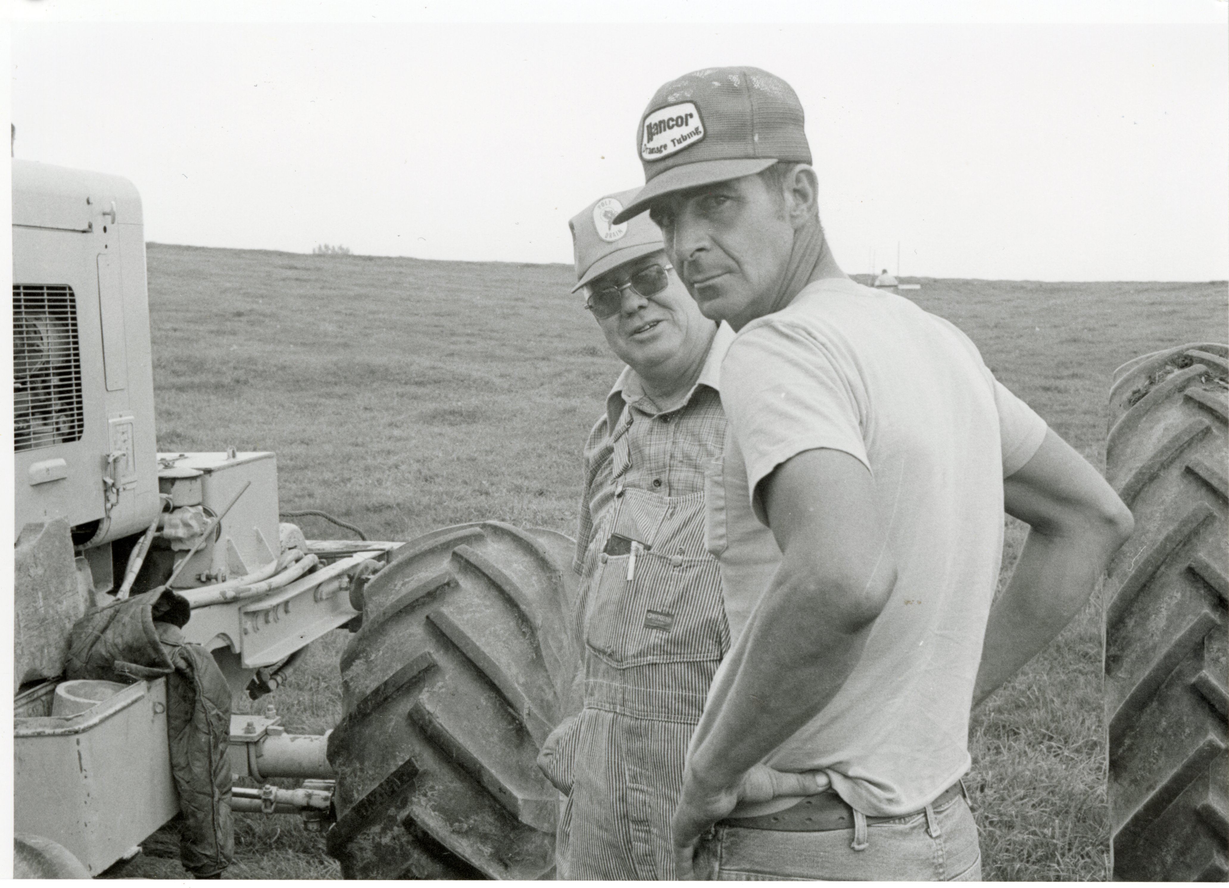 1979  Two farmers between tractors