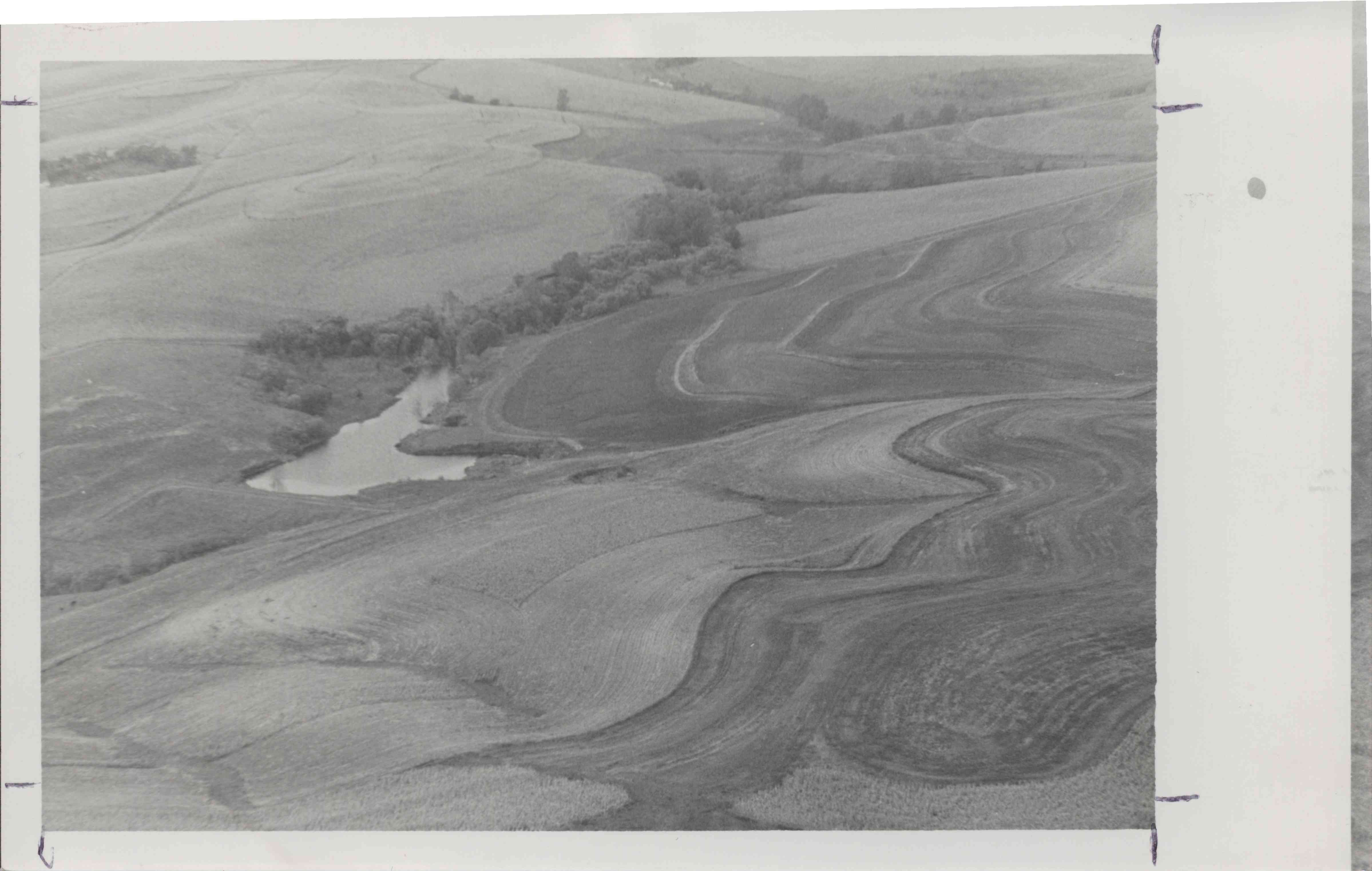 Photograph of contoured land with pond owned by Ron Loutsch