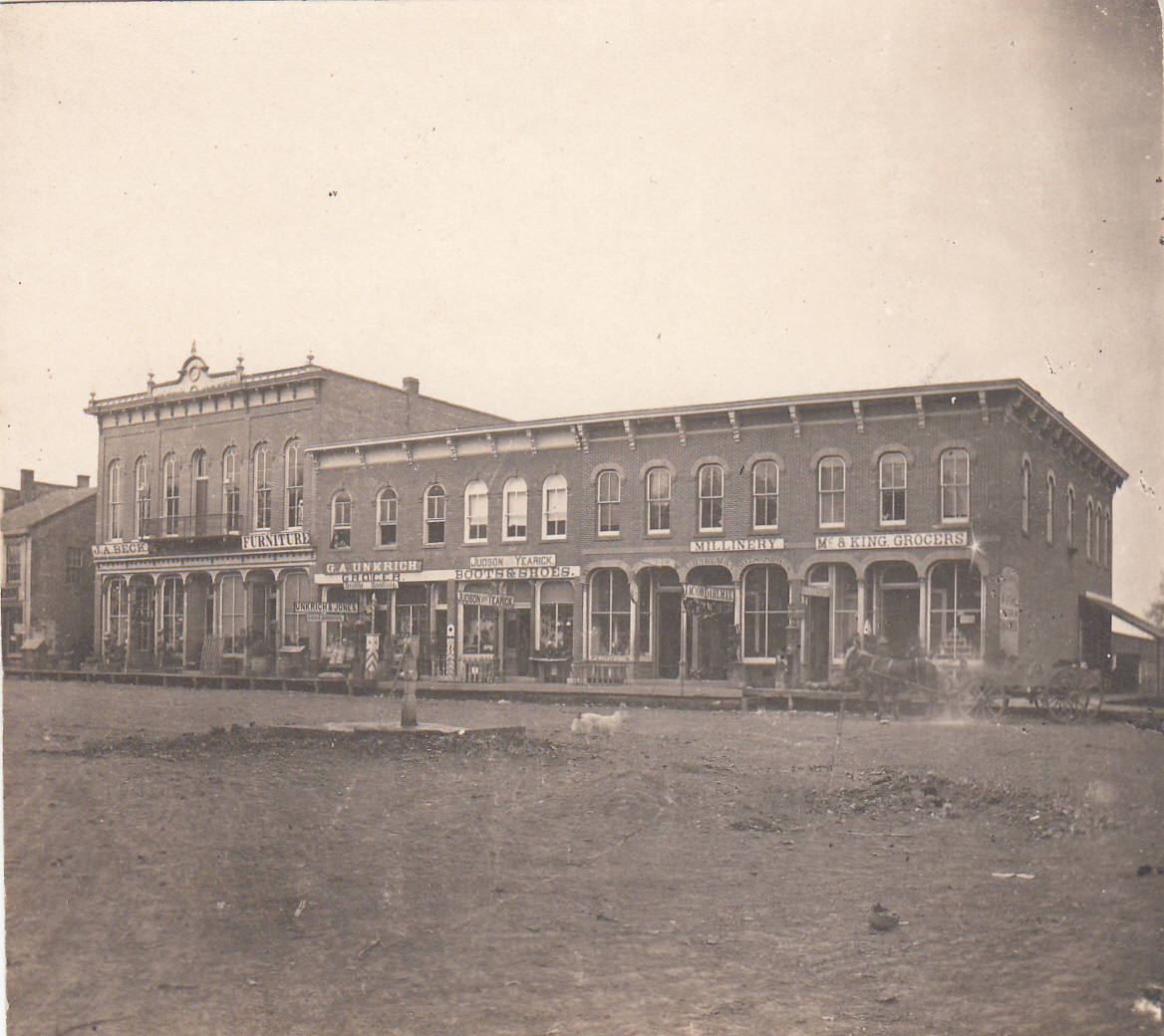 0118 South side of square in the 1870's showing a variety of businesses