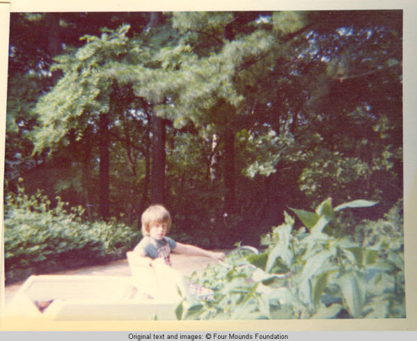 John, Jr. driving golf cart on lane
