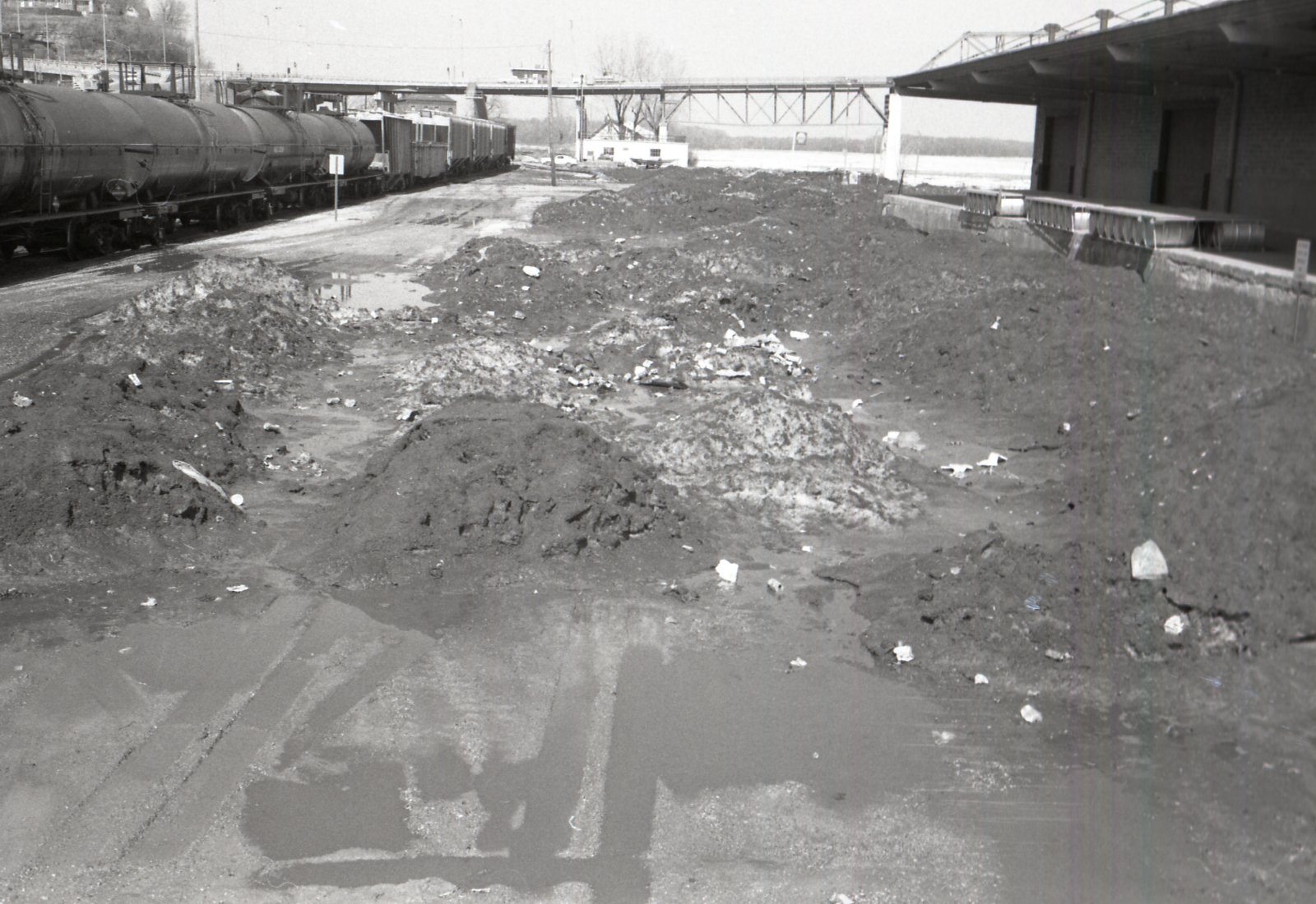 Train parked by station with dirt