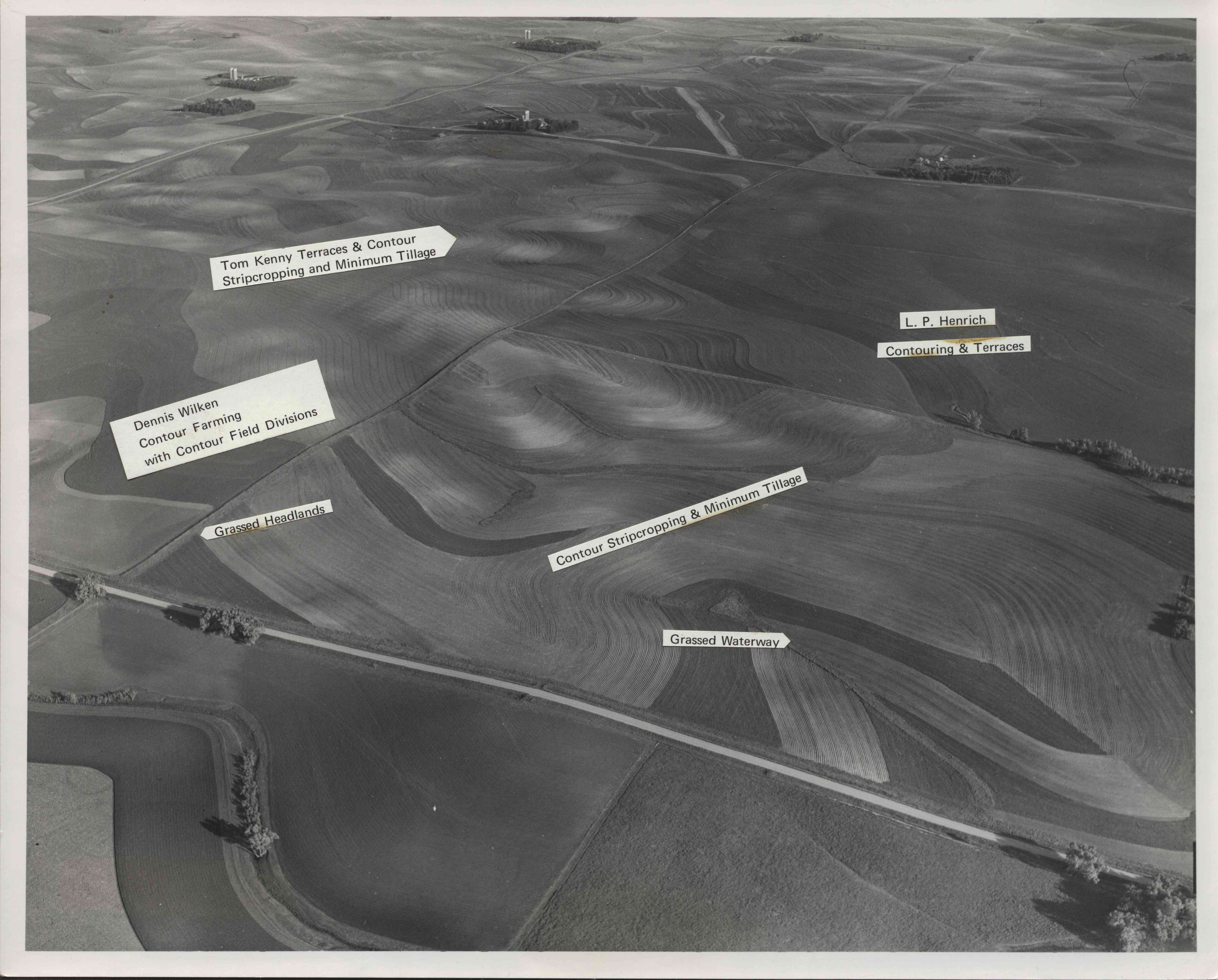 Aerial view of farmland showing strip cropping, terracing, contouring, waterways, grasslands and minimum tillage.