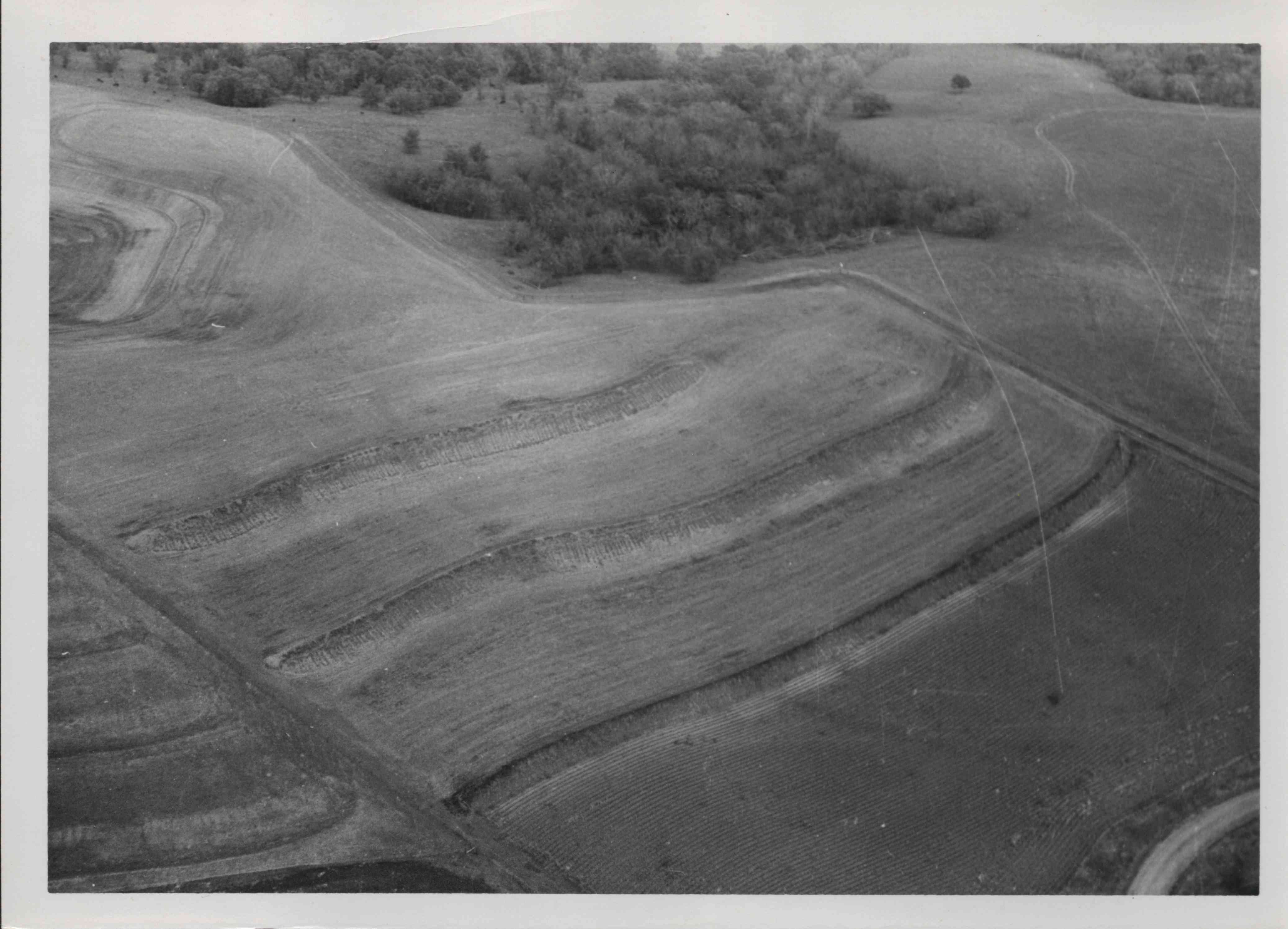 This aerial view of contoured land with trees in back belongs to D. Clifton in Plymouth County, Iowa