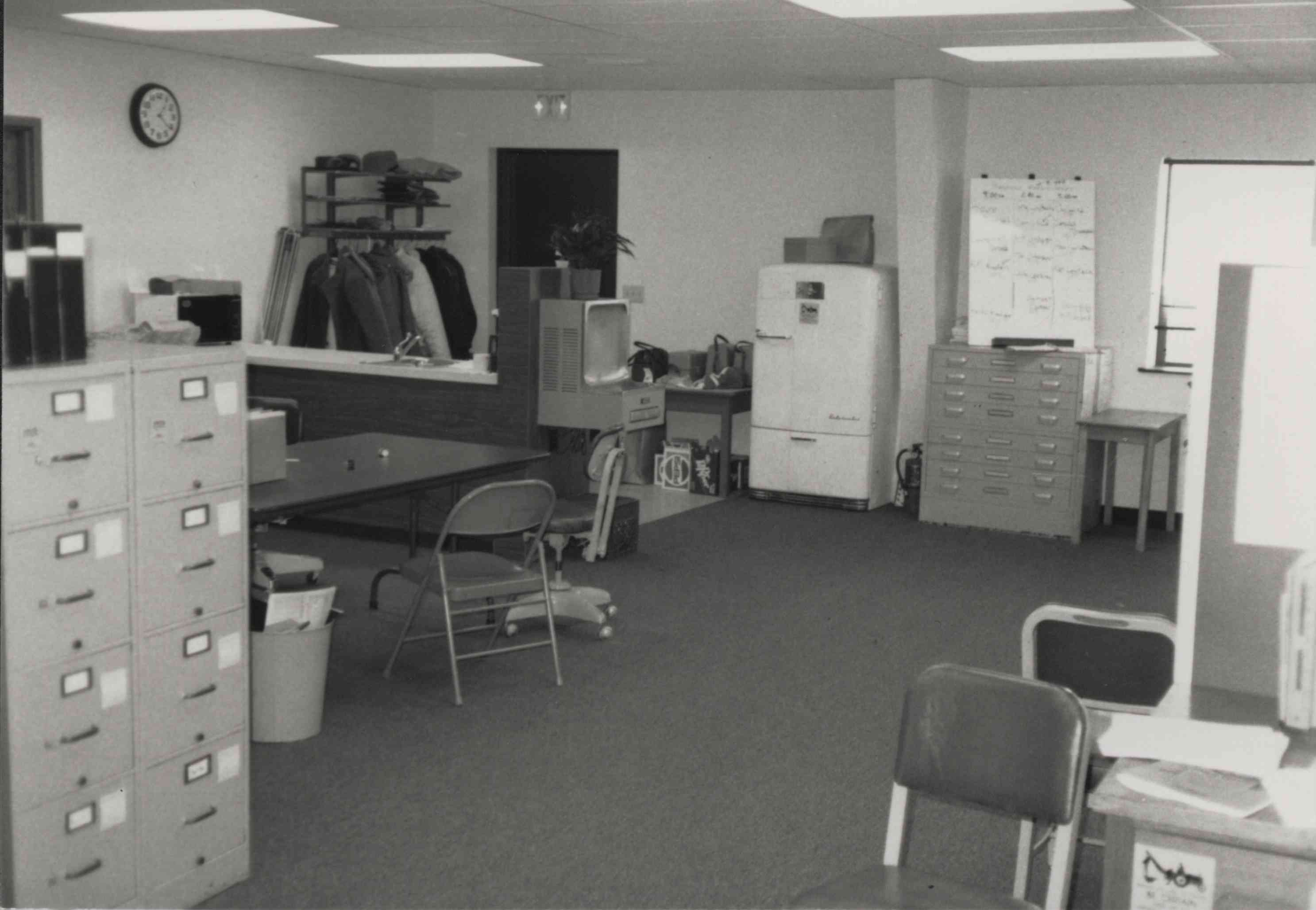 Office Photo with Refrigerator, Chairs and Table