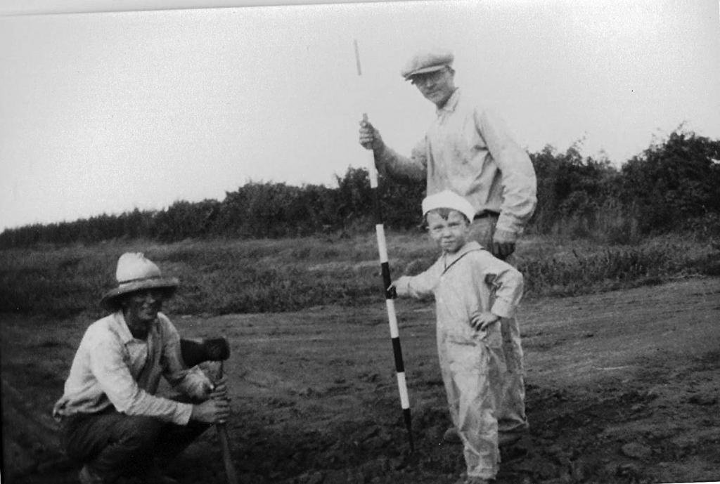 Joseph W. Johnson Sr. and Joseph W. Johnson Jr. with Survey Pole