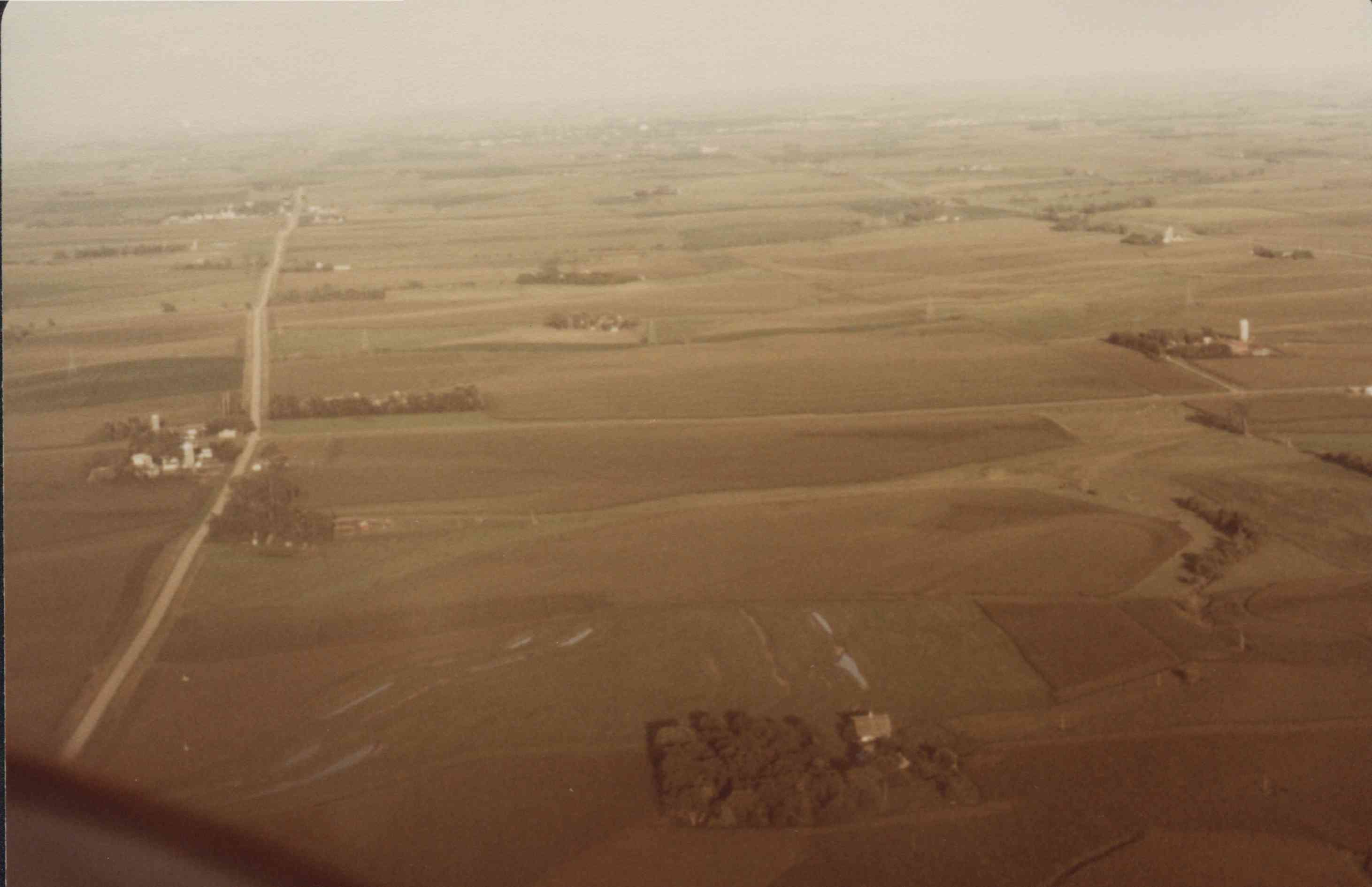 Unidentified color photo of farmland showing contouring