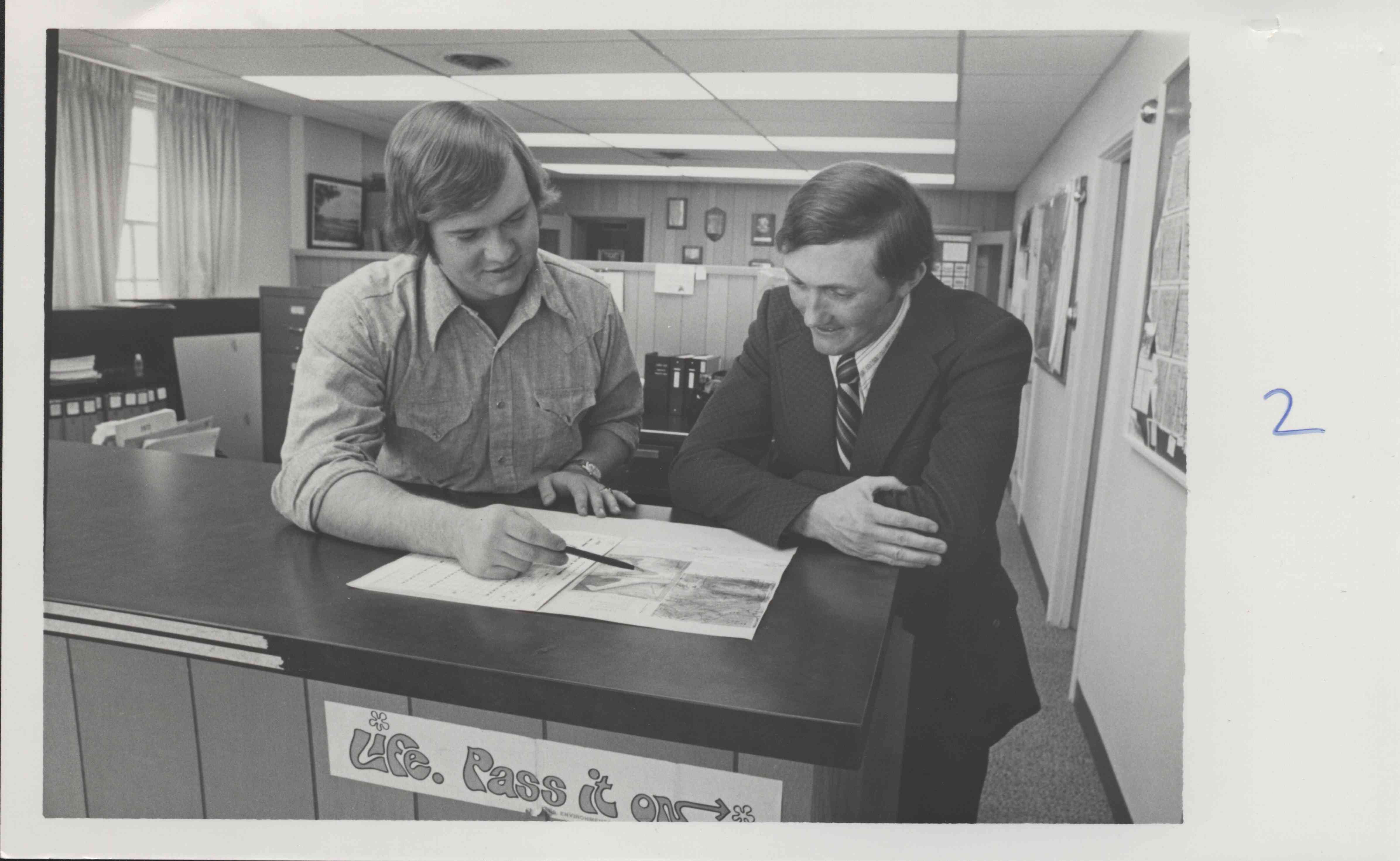 Two Men Studying Map
