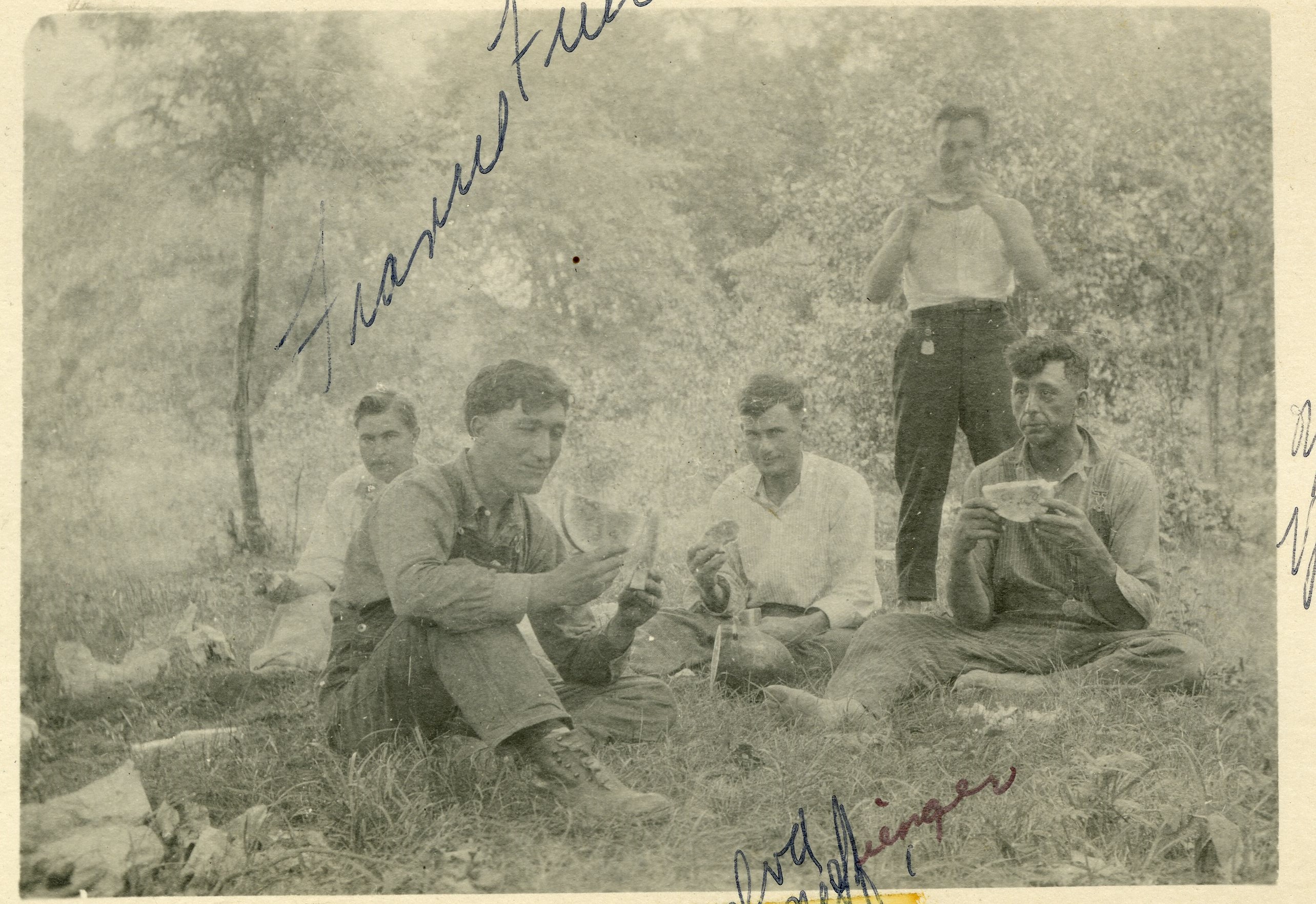 Group of men eating watermelon