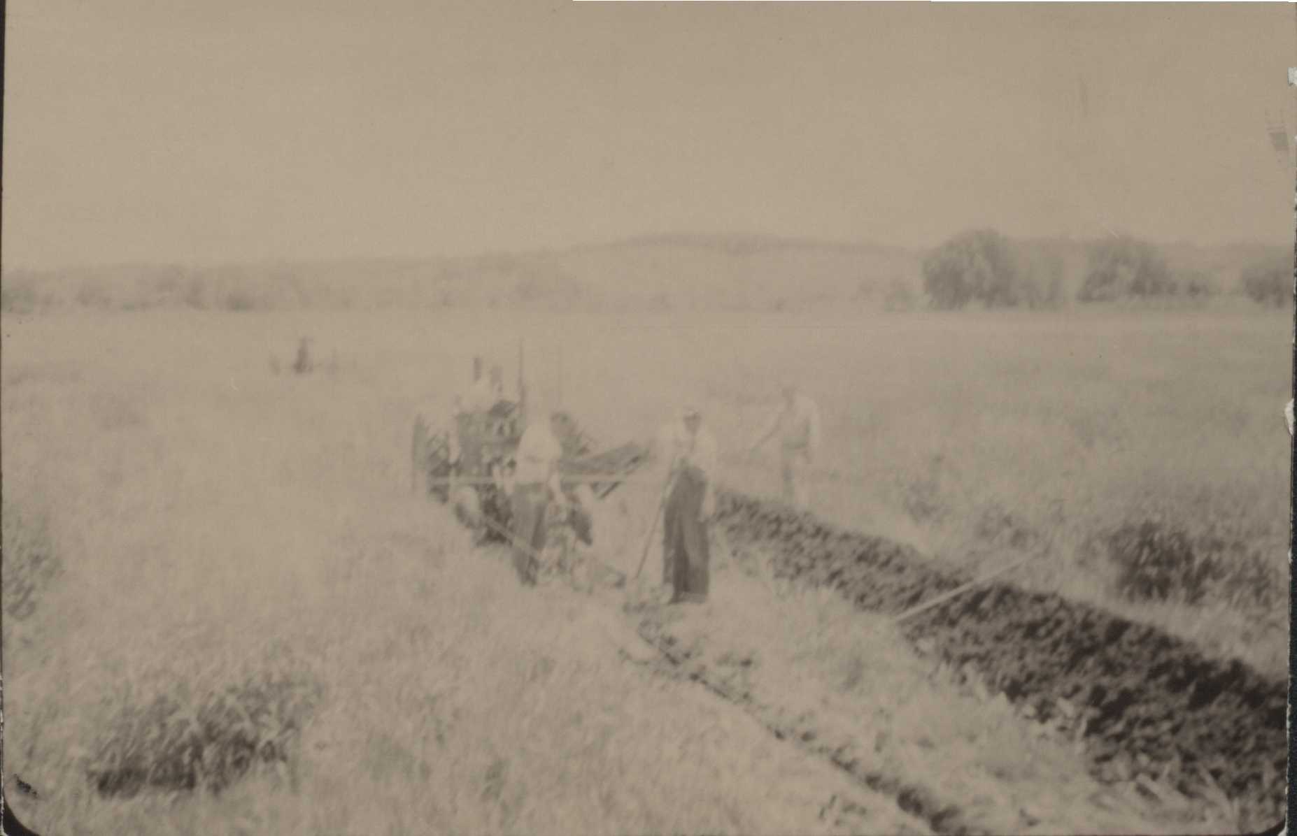 Installing a tiling channel on W. Brain's farm.