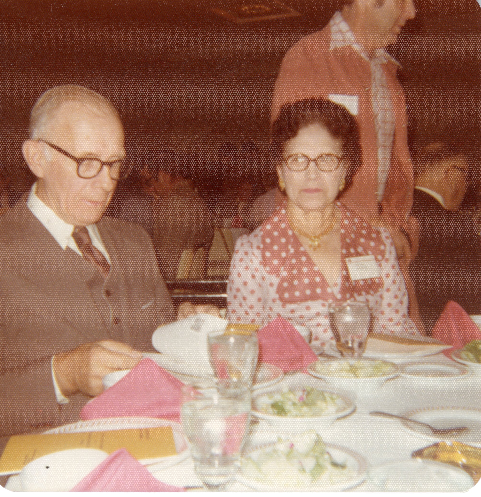 Mr. and Mrs. C. Iles Heady sit at a conference dinner