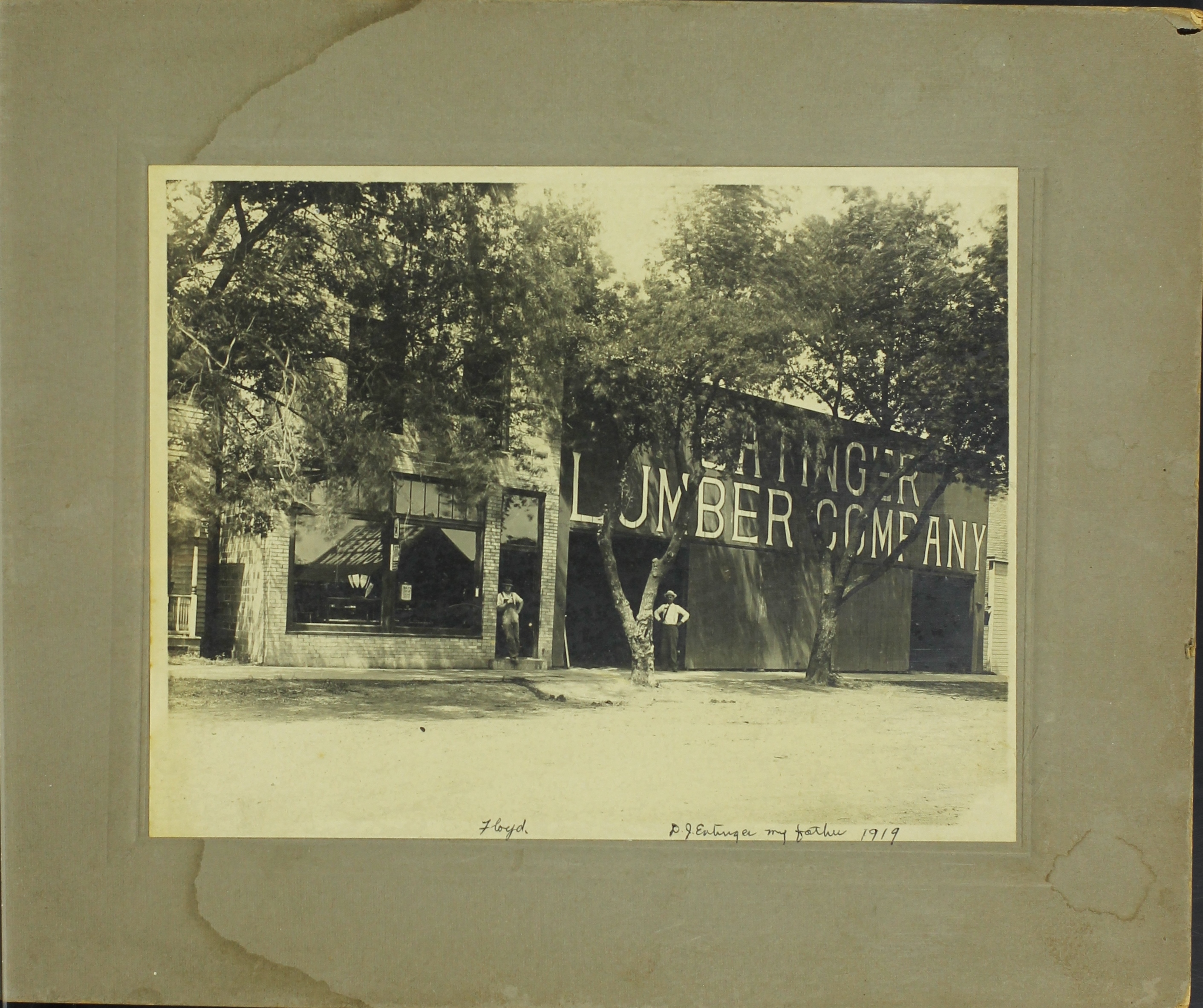 Floyd and D.J. Entinger Stand in front of the Entinger Lumber Company