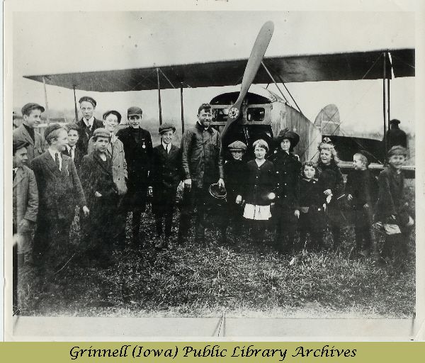 Billy Robinson with children and airplane 