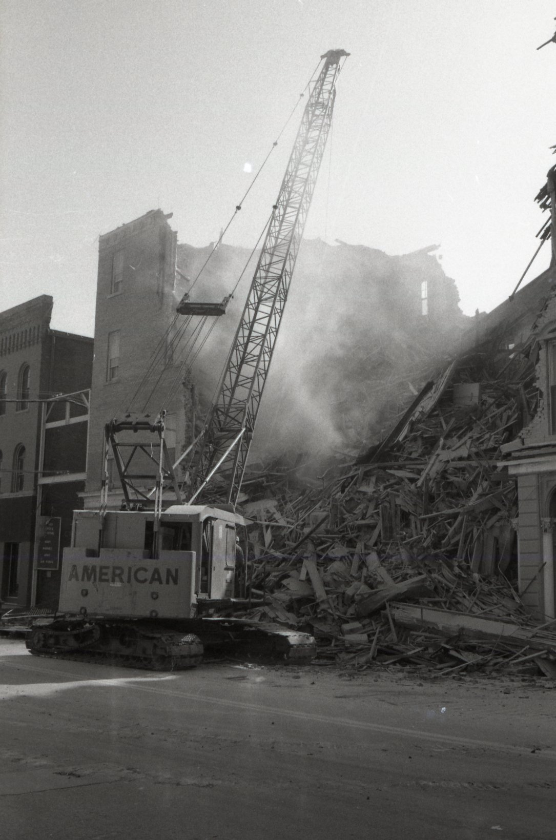 Crane demolishes building