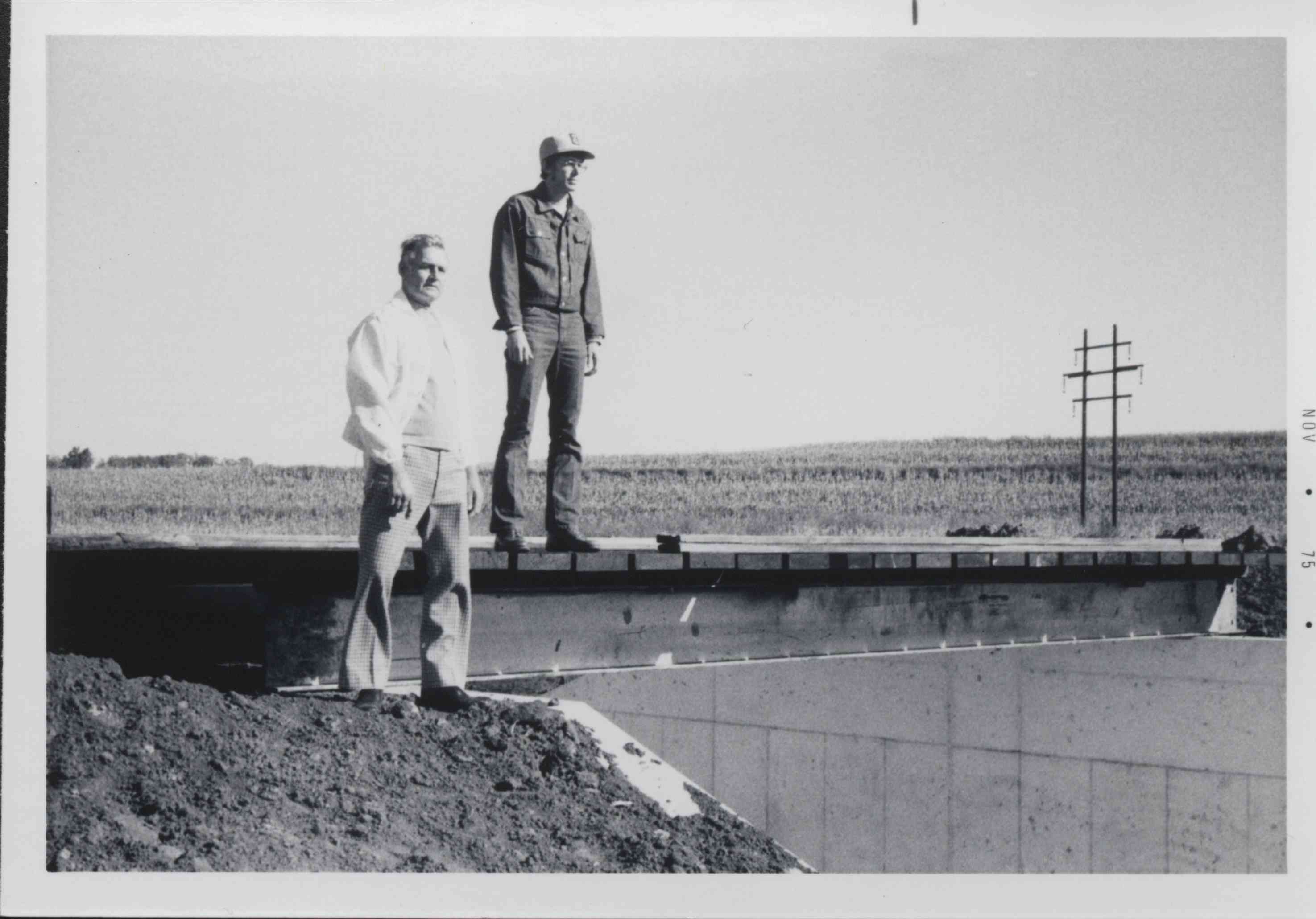 Two Men stand on top of watershed