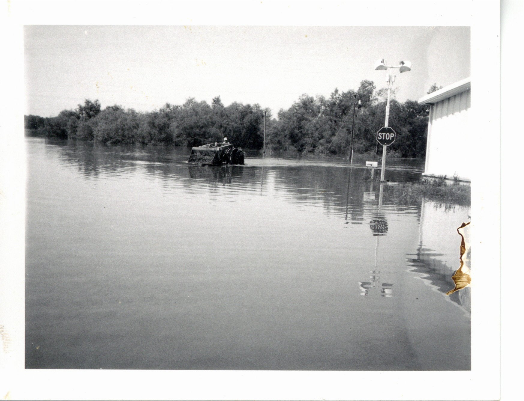 Flood waters surrounding Gulf gas station, 1969