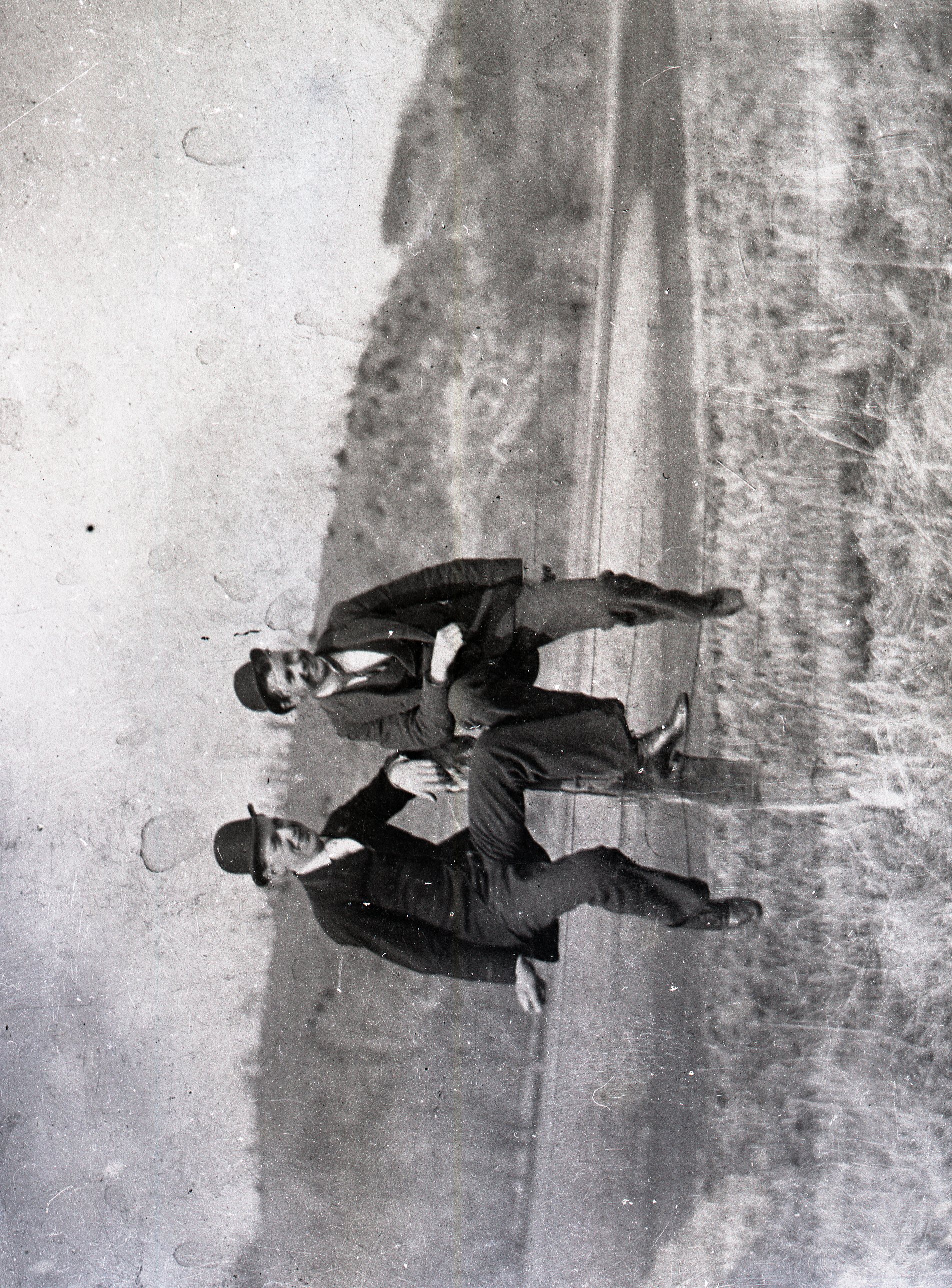 Two men on fence