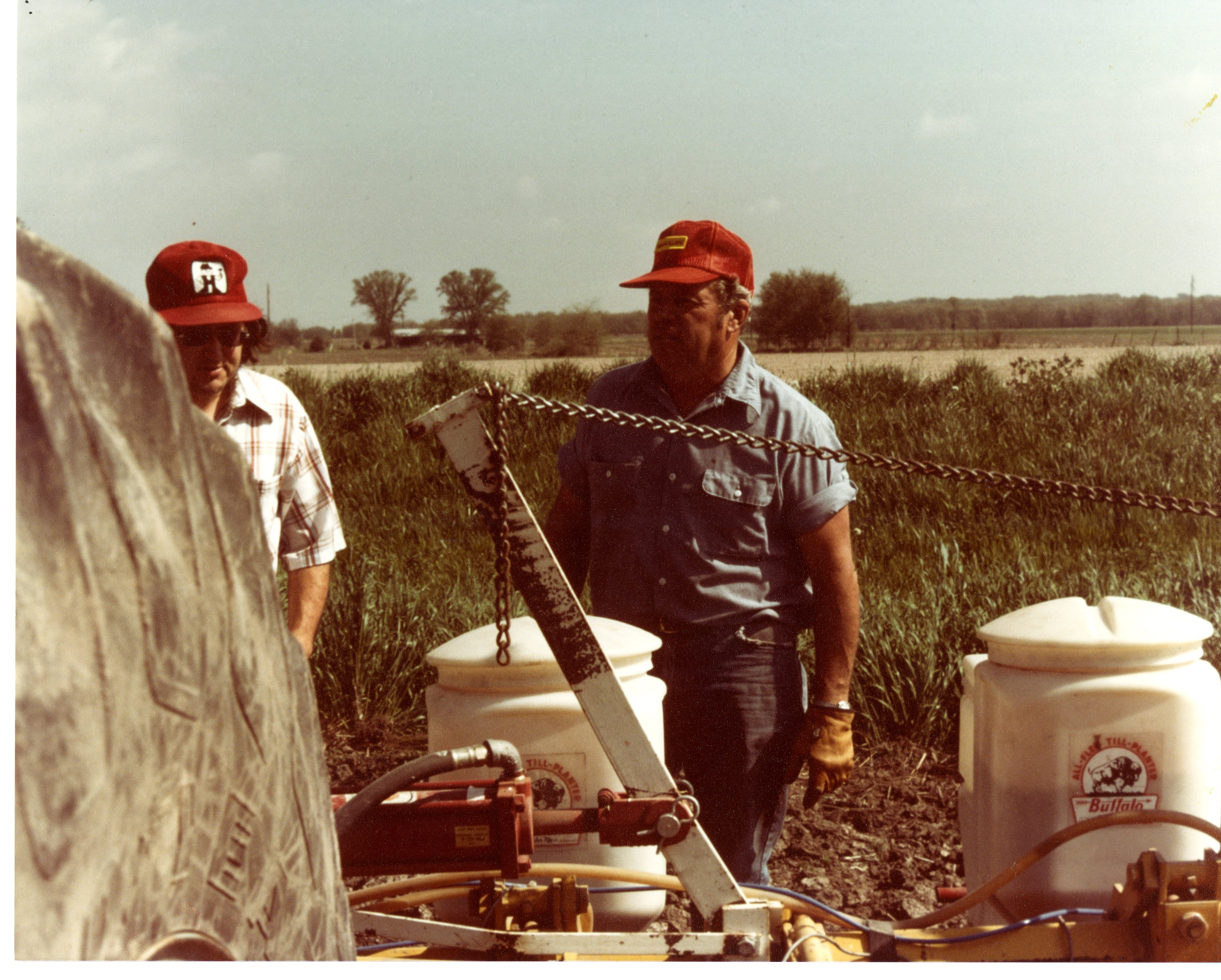 Two Farmers Setting Up Till Spraying