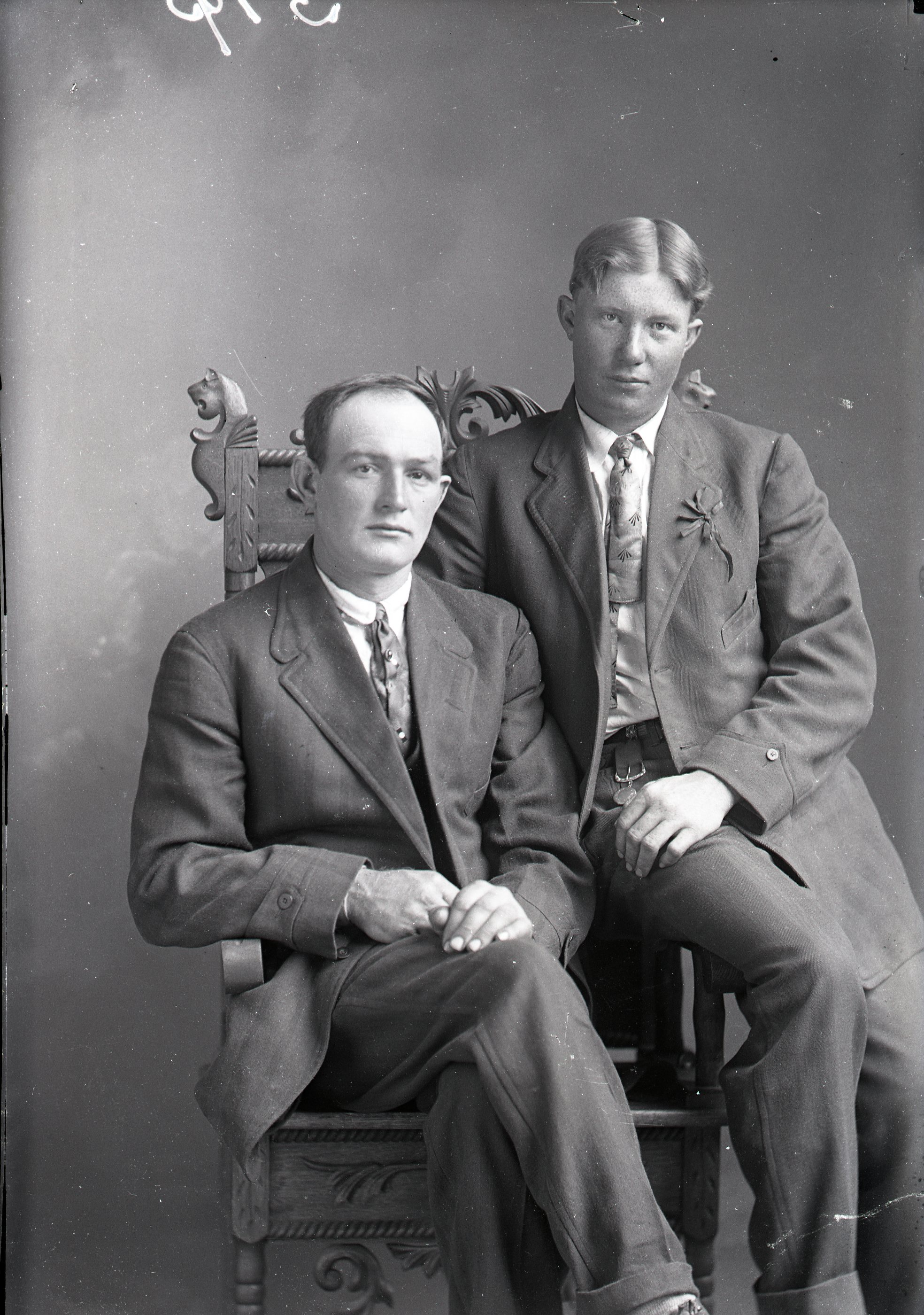 Two men, seated