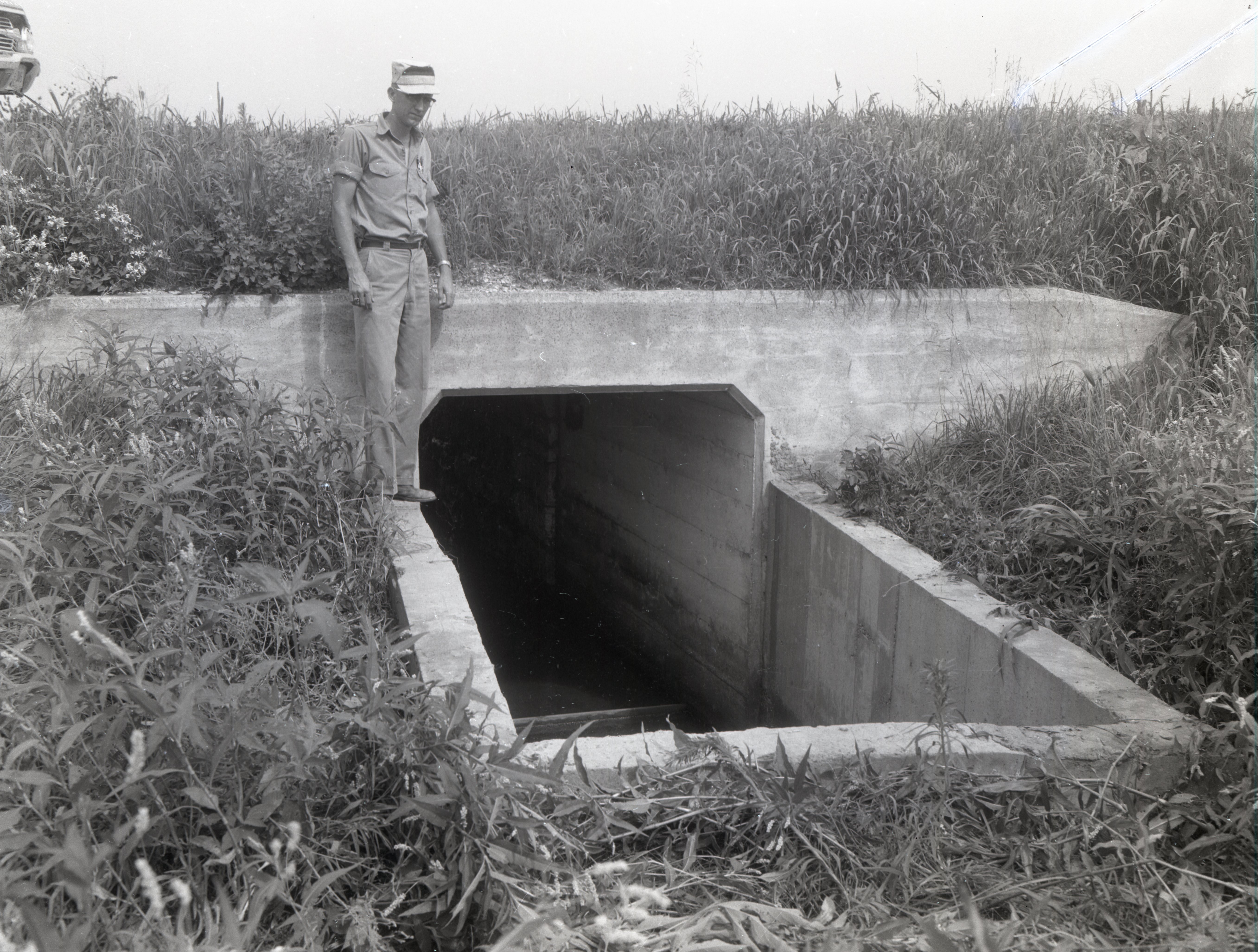 Man stands on watershed structure