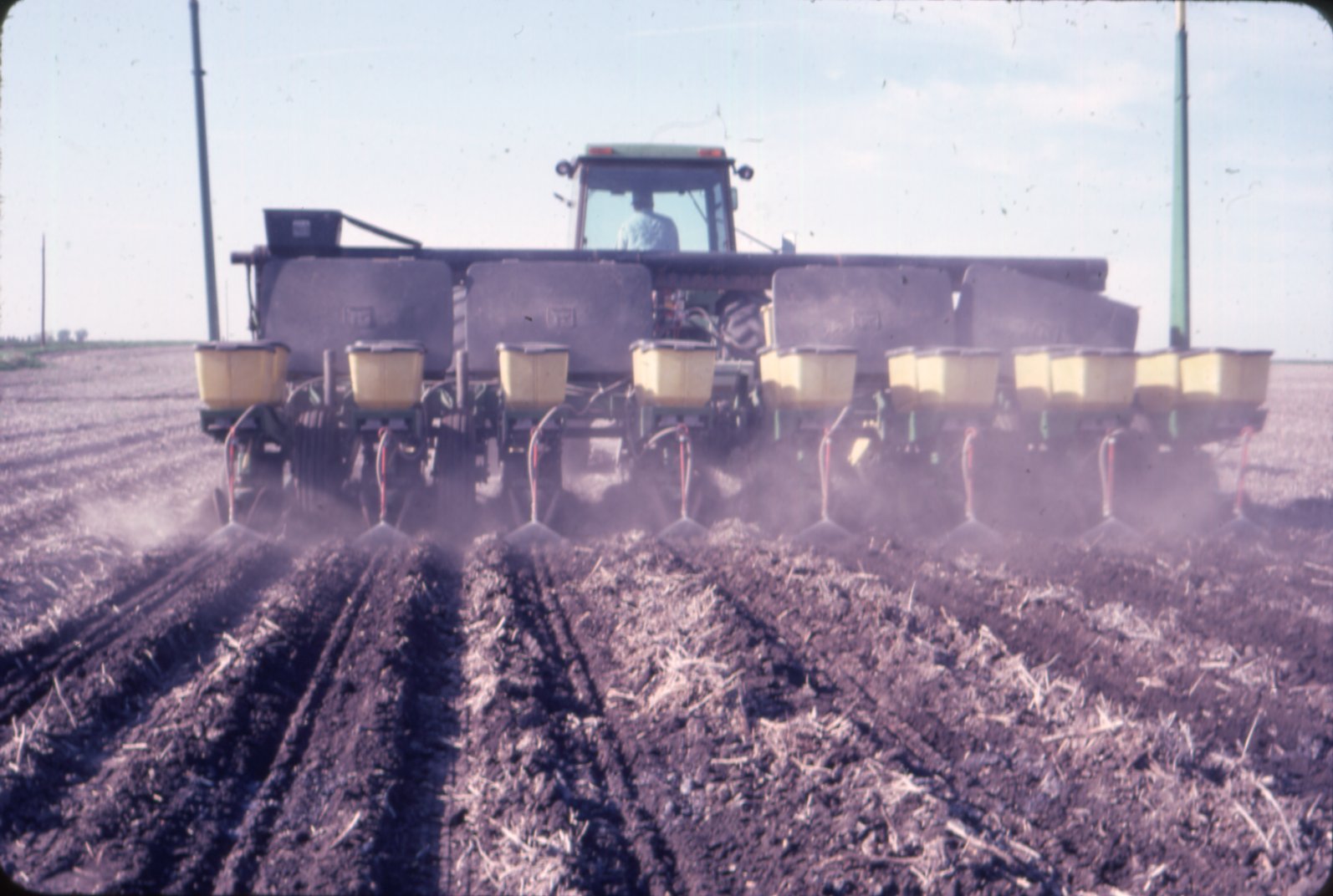 Ned Hunger spraying no-till crops, 1983
