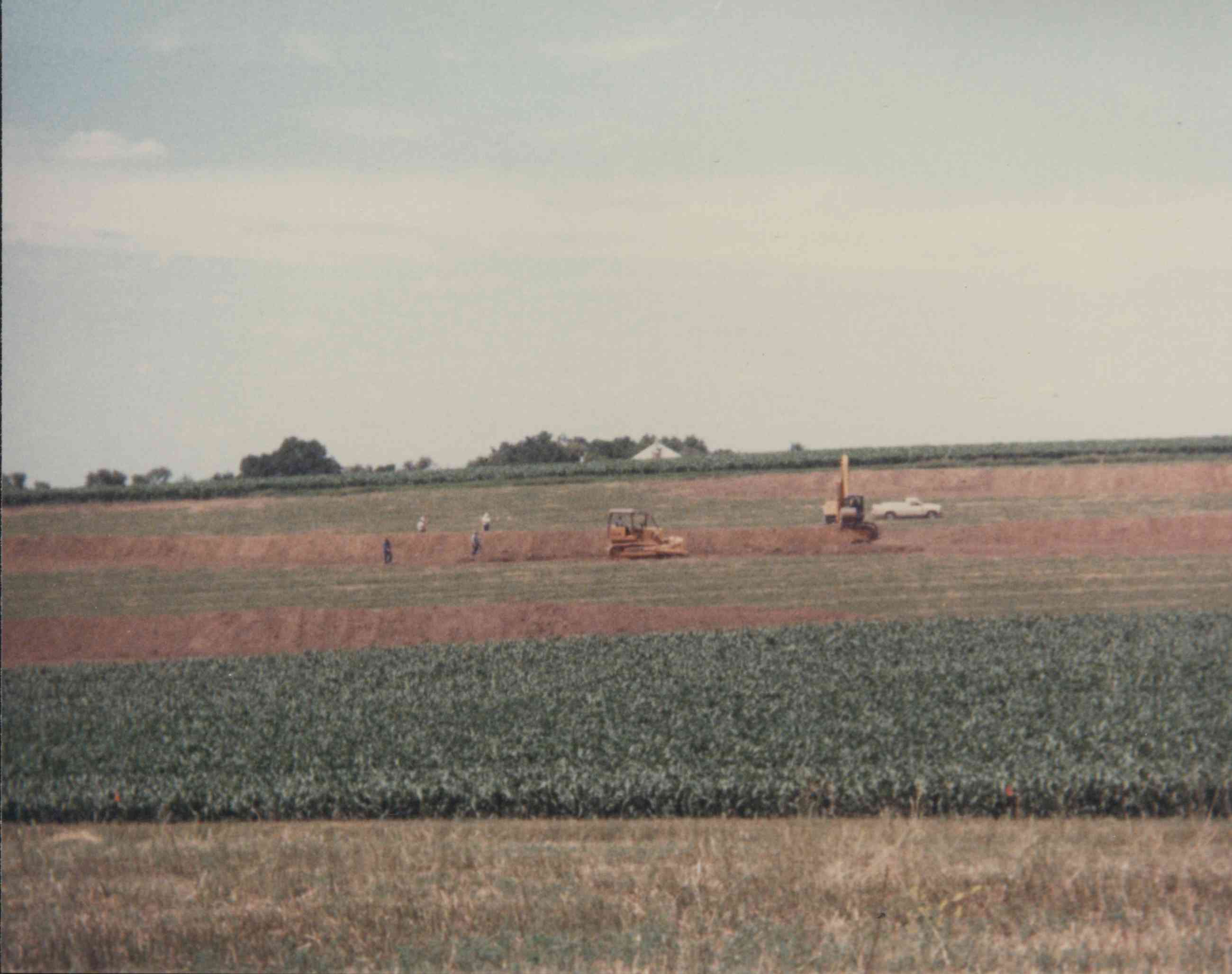 Two bulldozers, truck and four people