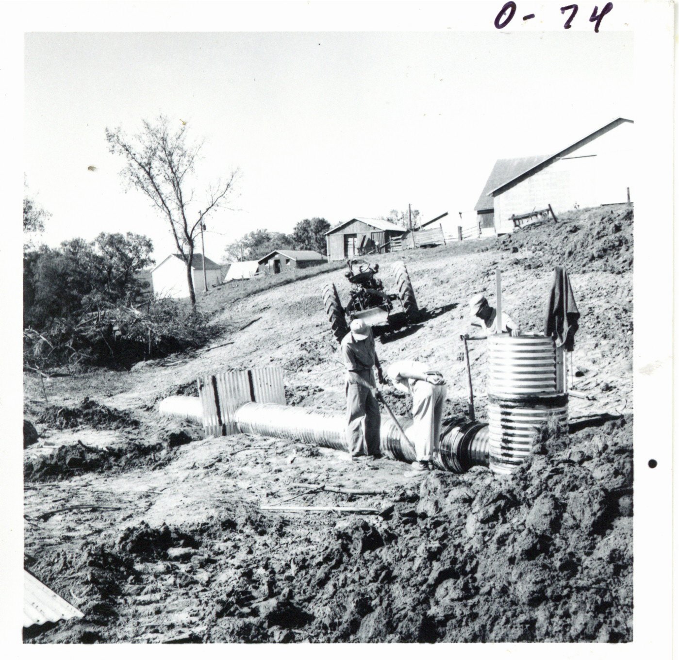 Installing pipe spillway on Harvey Michel land, 1968