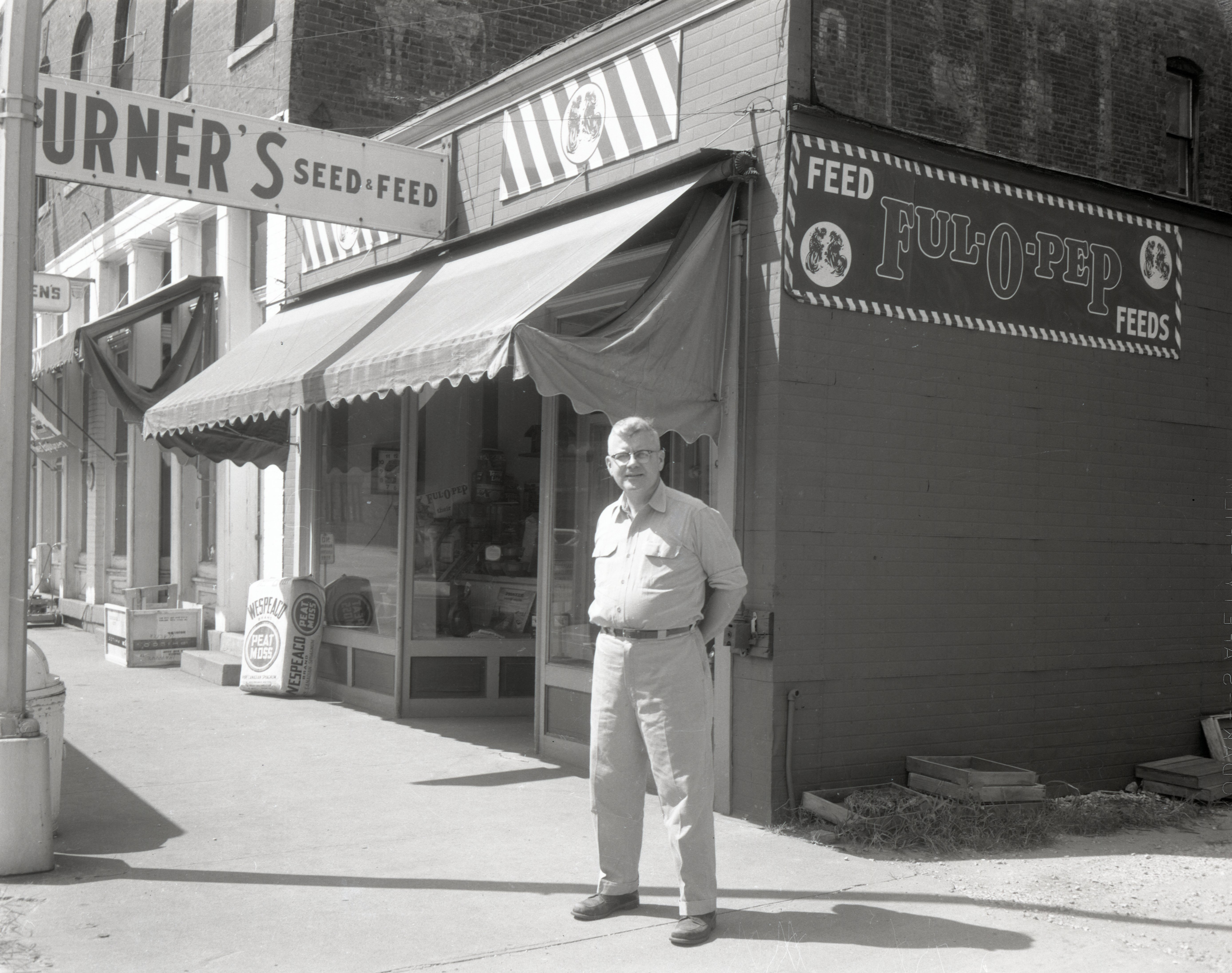 Man stands in front of feed store