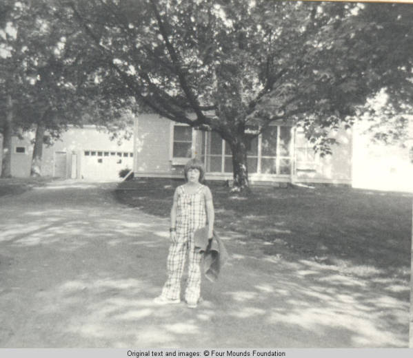John, Jr. standing on lane with towel in hand