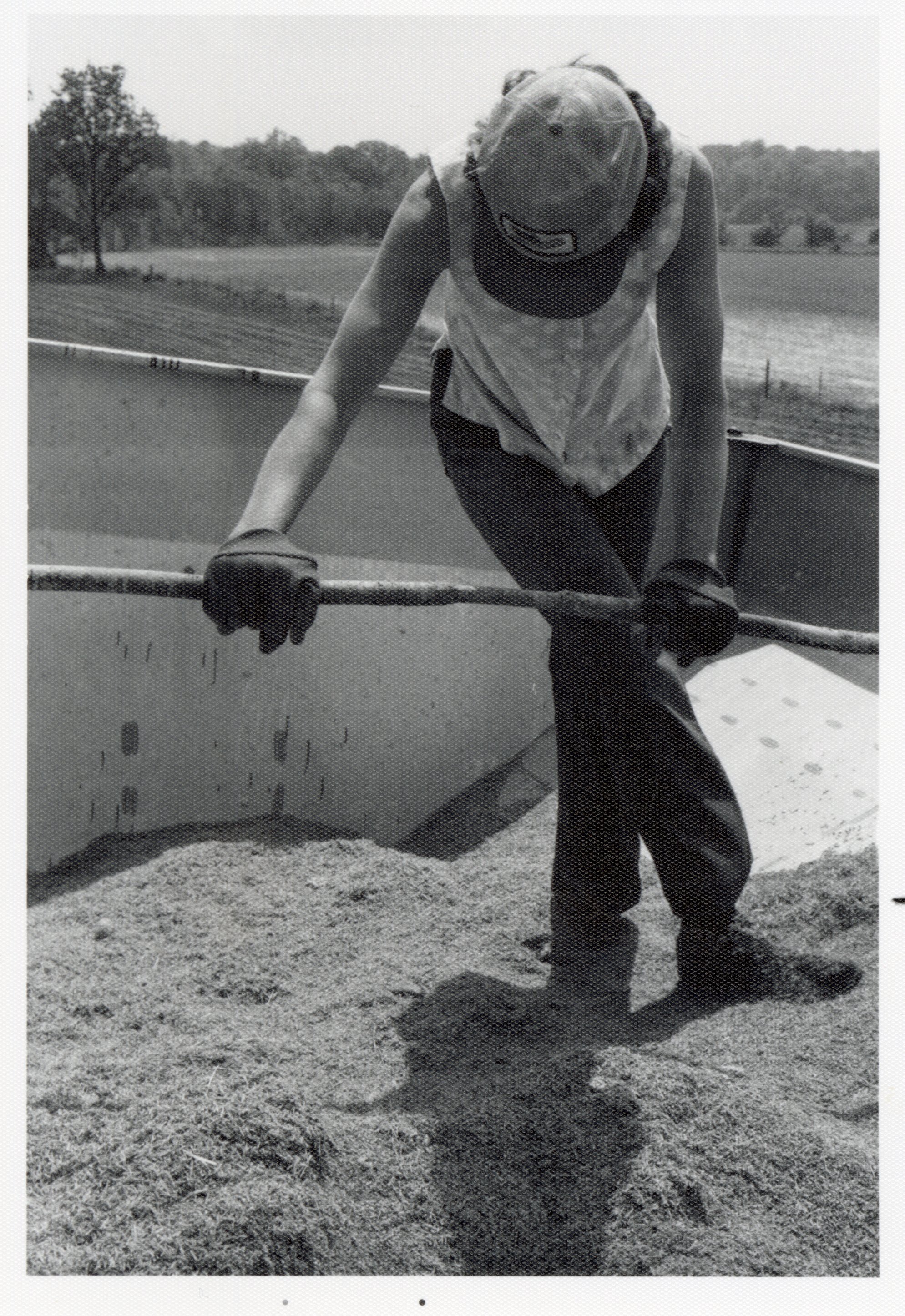 1978 Theresa Beckman in wagon with seed