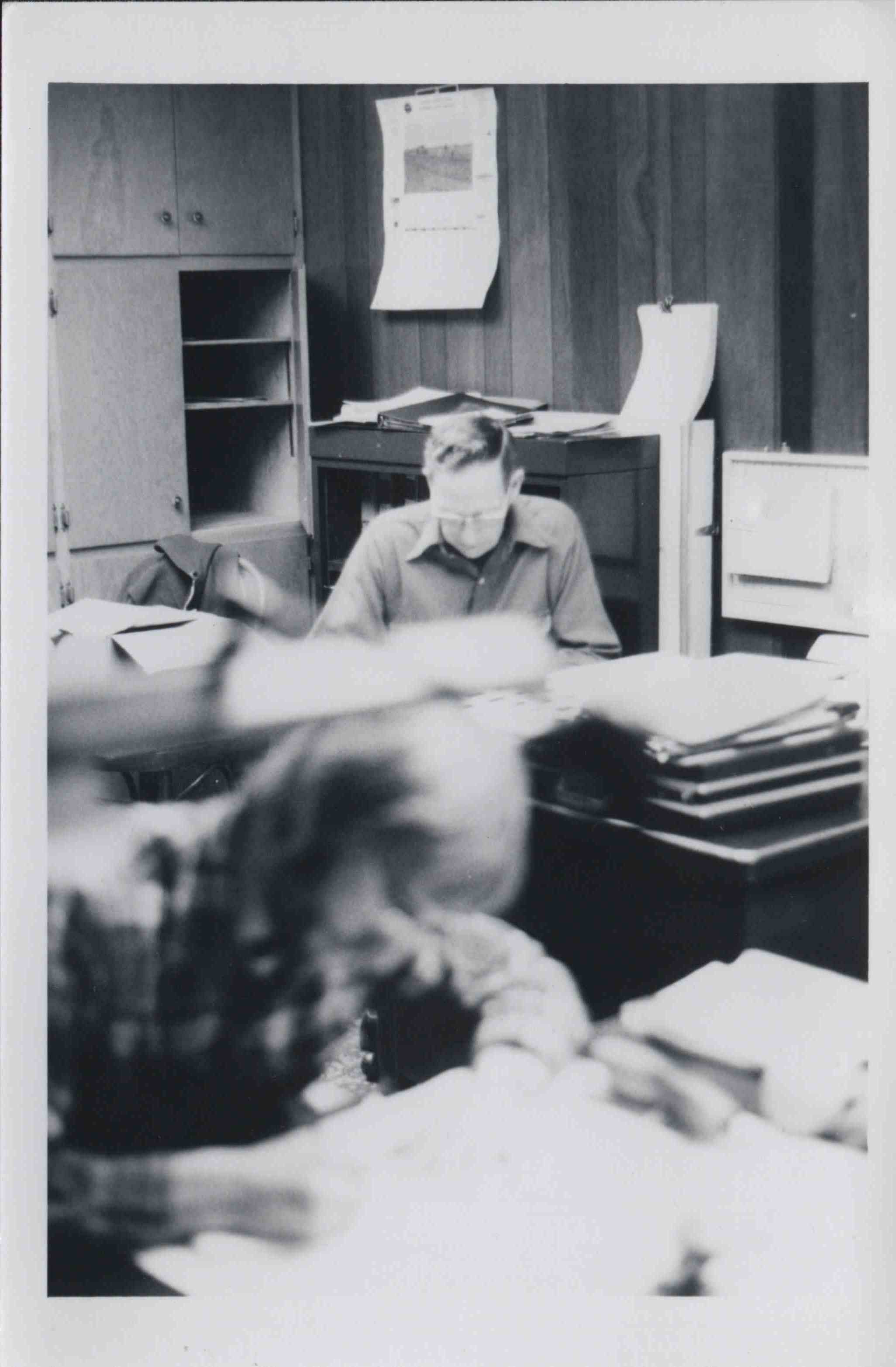 Man Sitting at Desk 