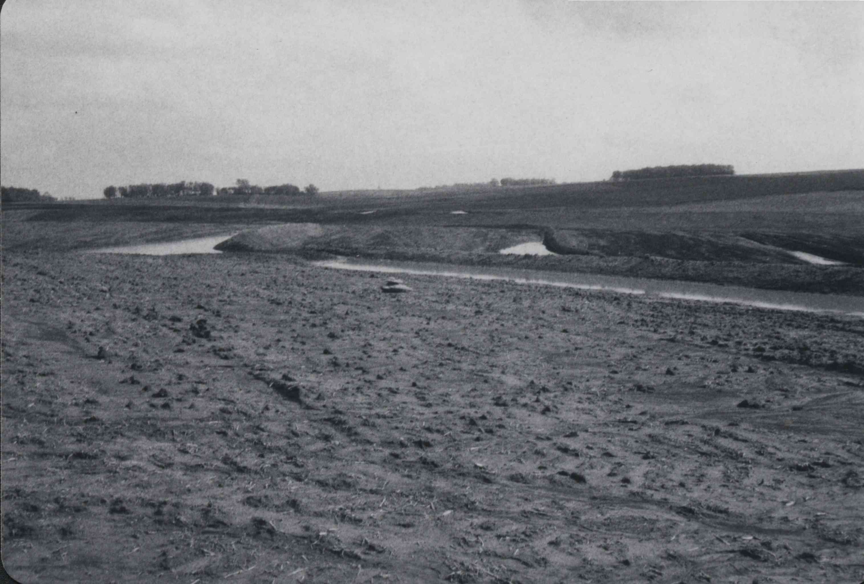 Mud Soaked Field with stream at one end