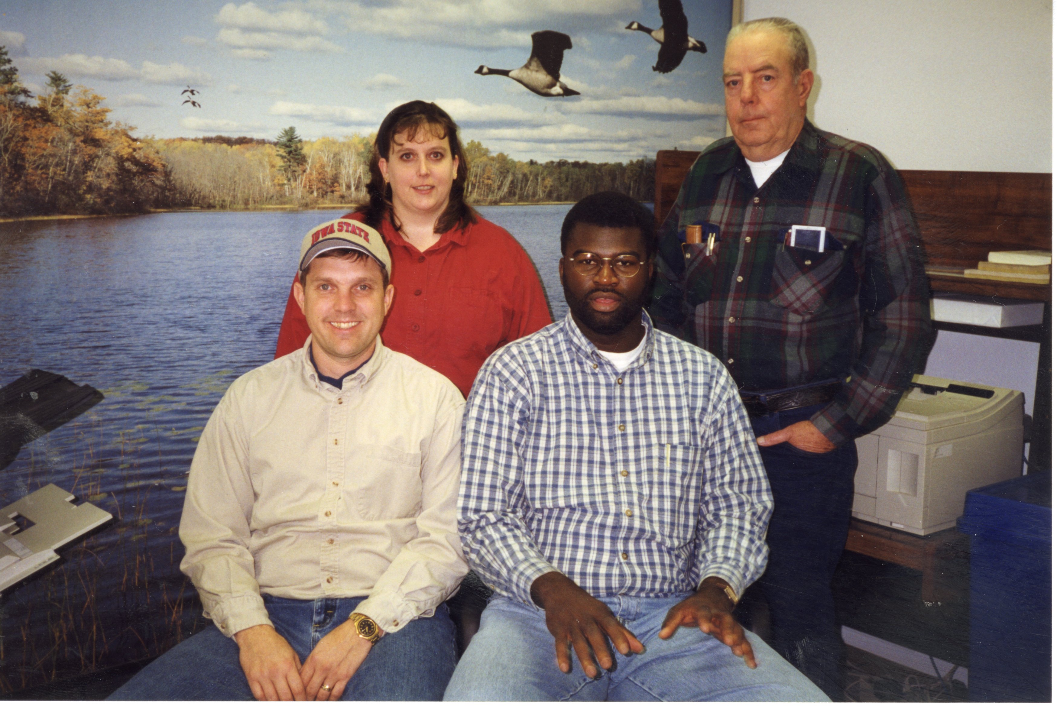 1999 Office Staff at the Des Moines County Soil and Water Conservation District include: front John White and, J.B. Martin Back Jamie Grimes and  John Horan
