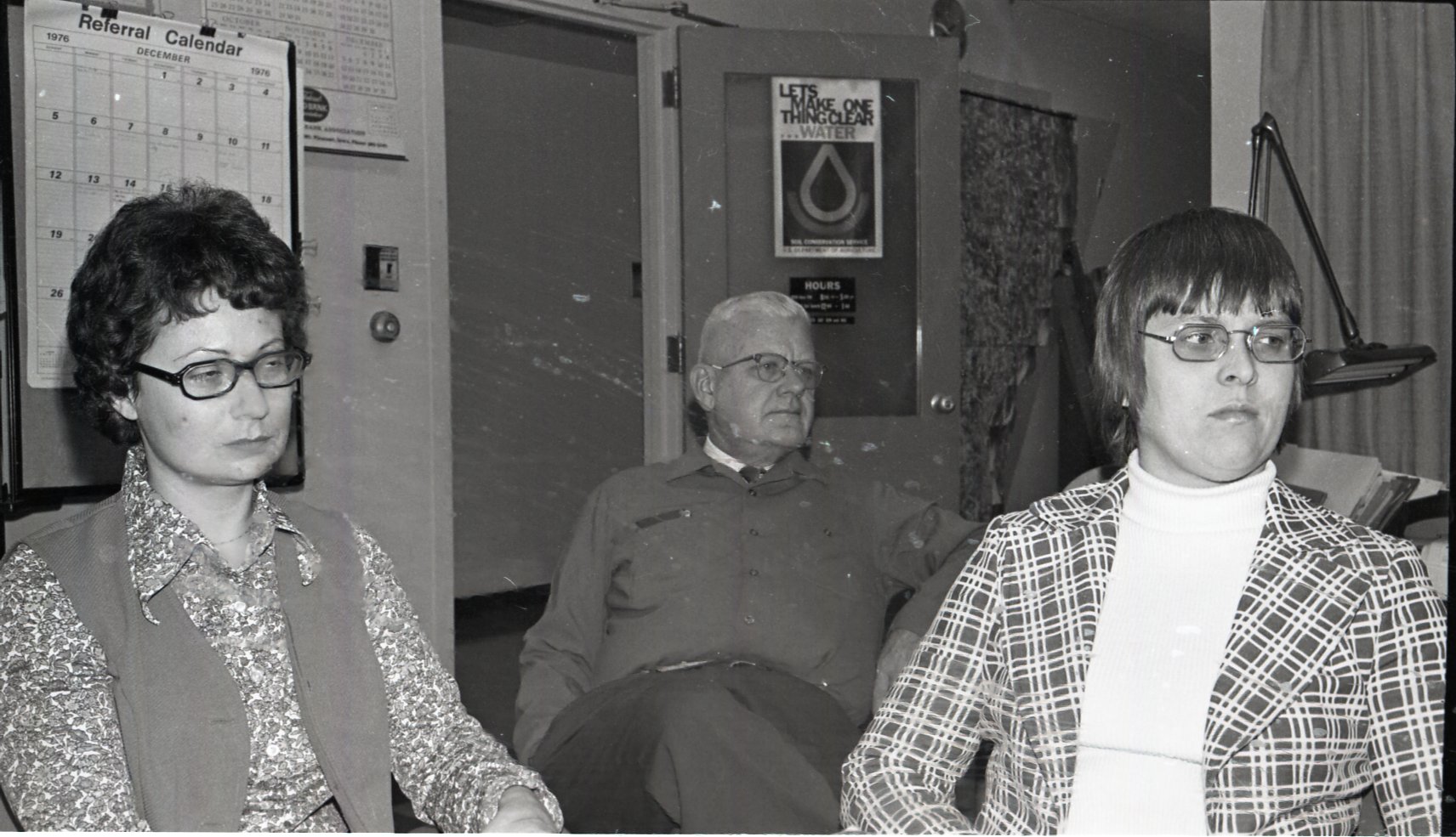 1976 Commissioners sit at a meeting