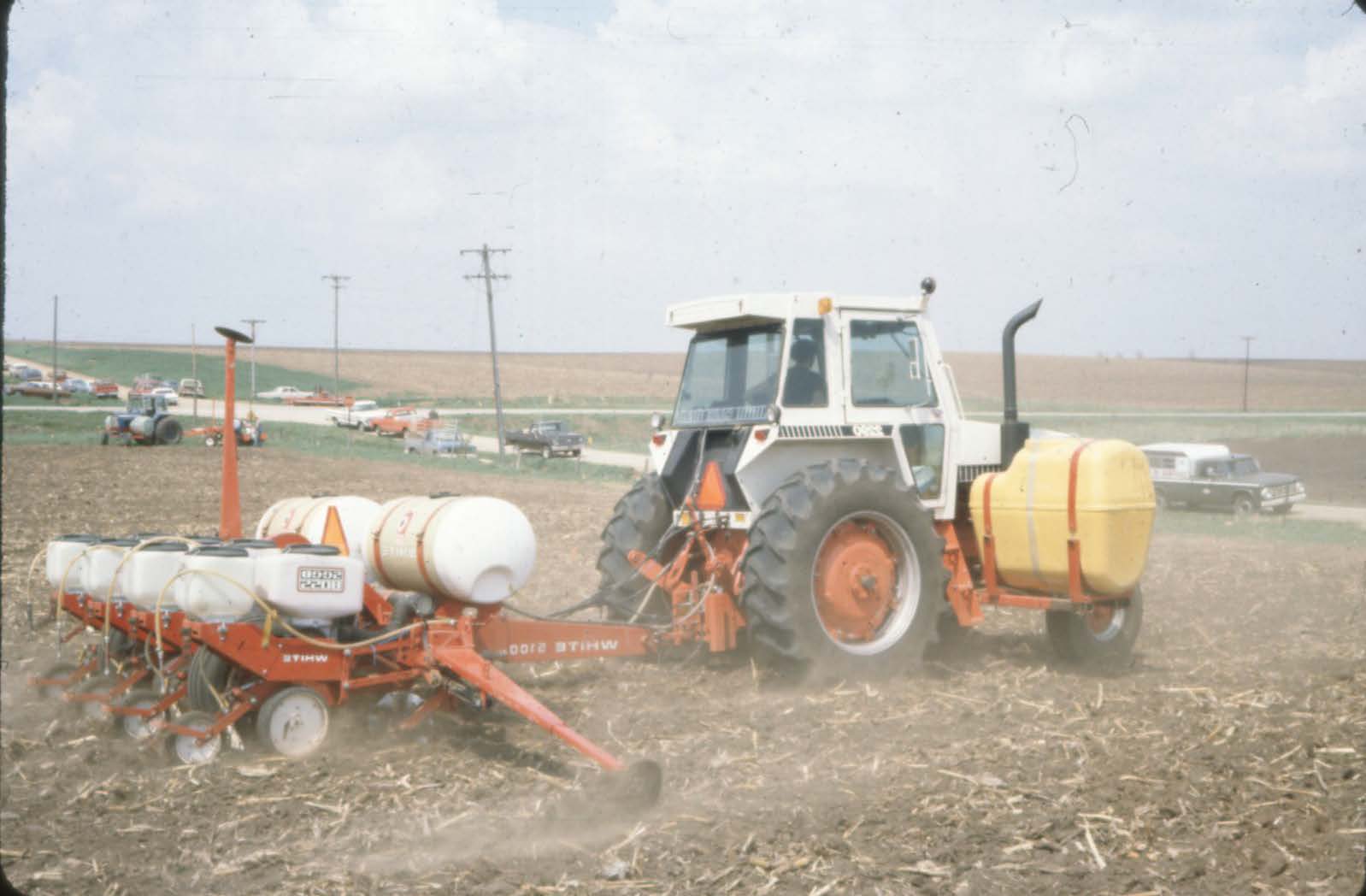 Tractor spraying in field 