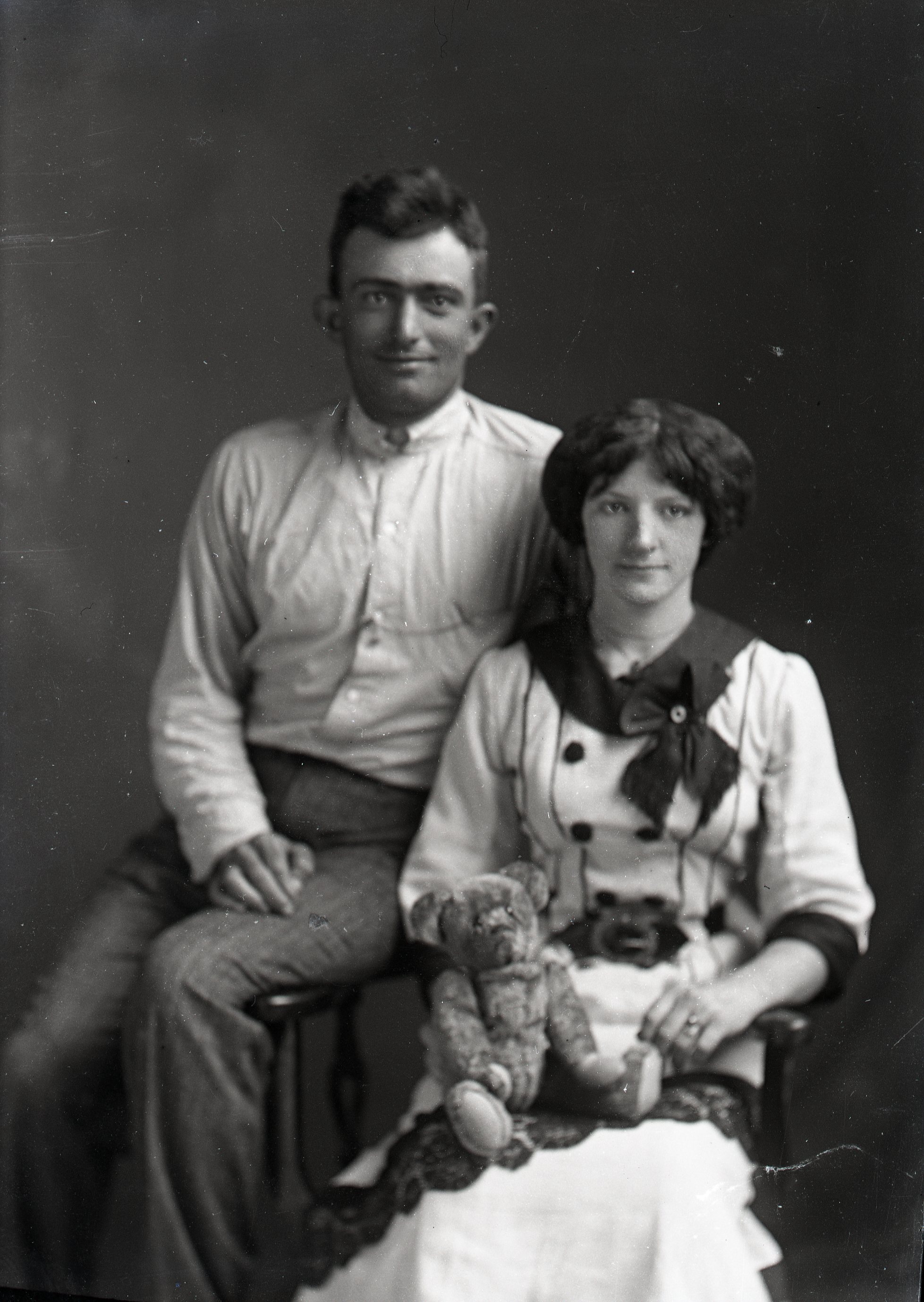 Man and woman with teddy bear