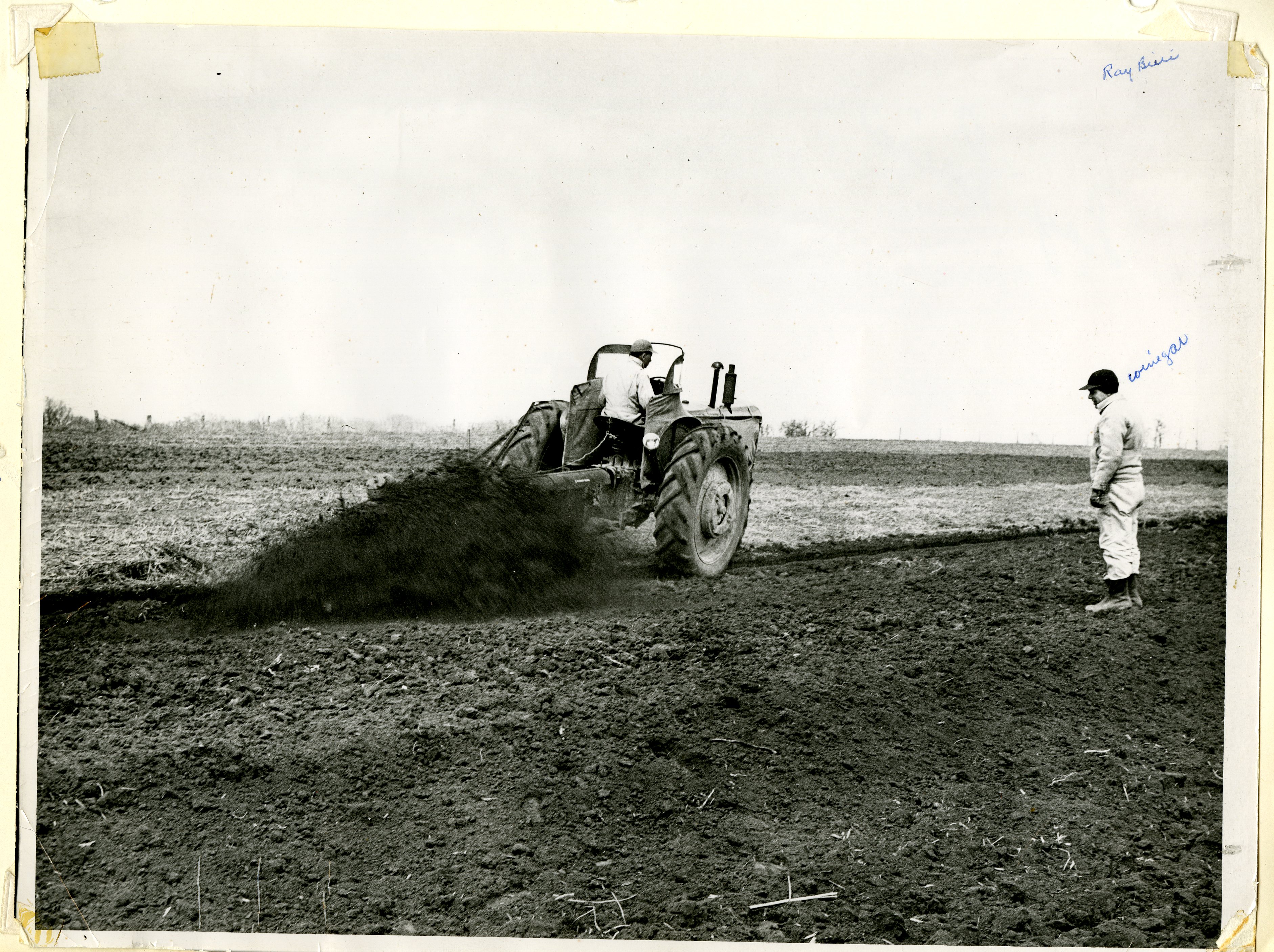 Farmers Using Auger