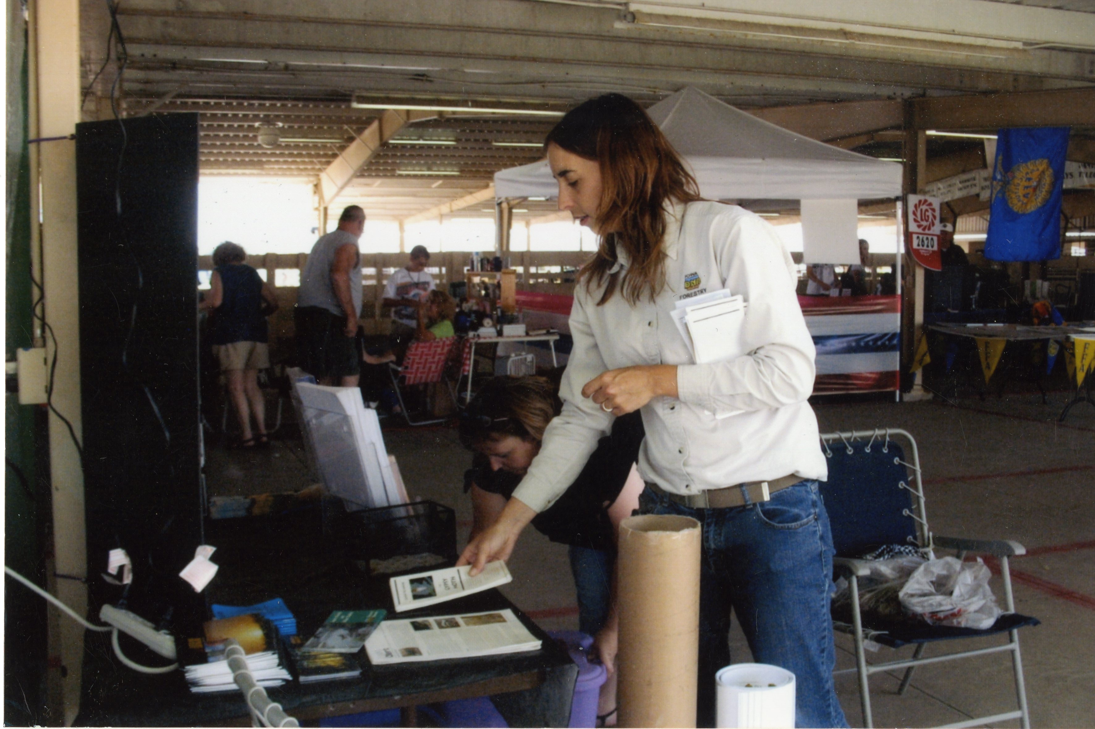 2009  Fair Booth helper Forester Lisa Louck stands at information booth